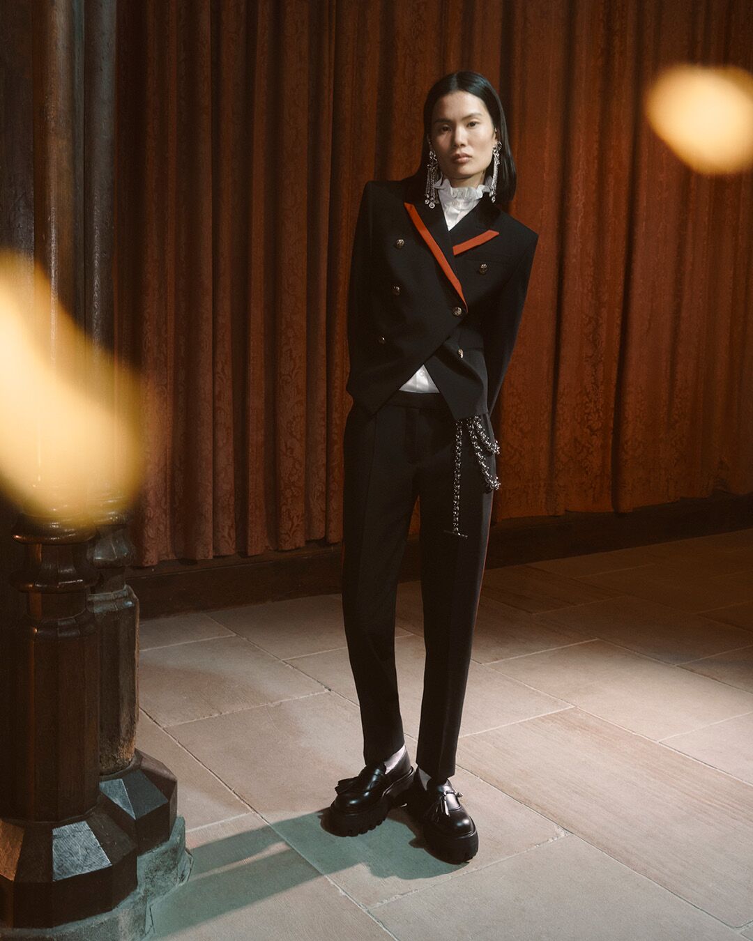 Model on set for McQueen Pre SS26 Campaign