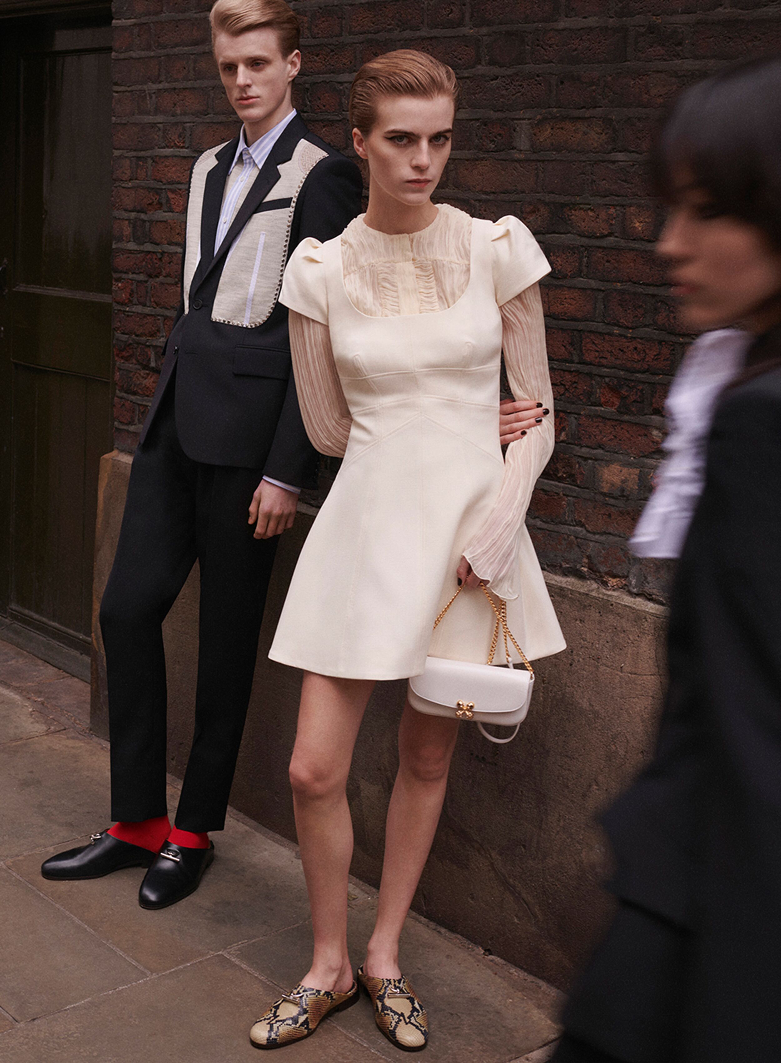 Model wearing a baby pink McQueen dress