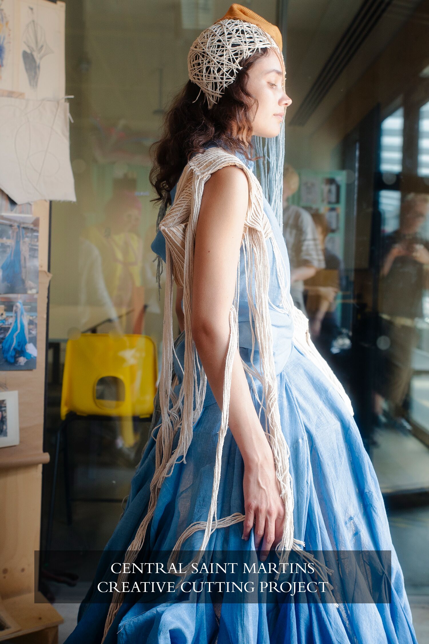 A model wearing a blue dress