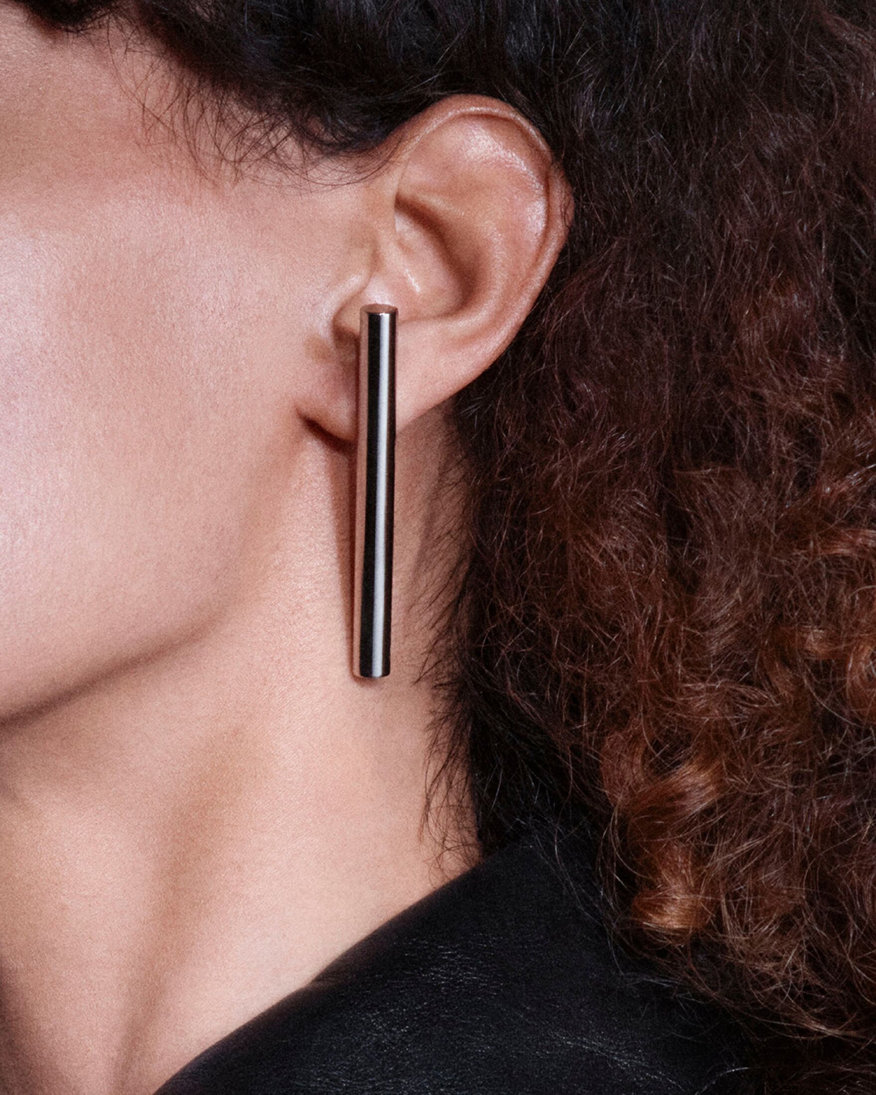 Women wearing T-Bar silver earring