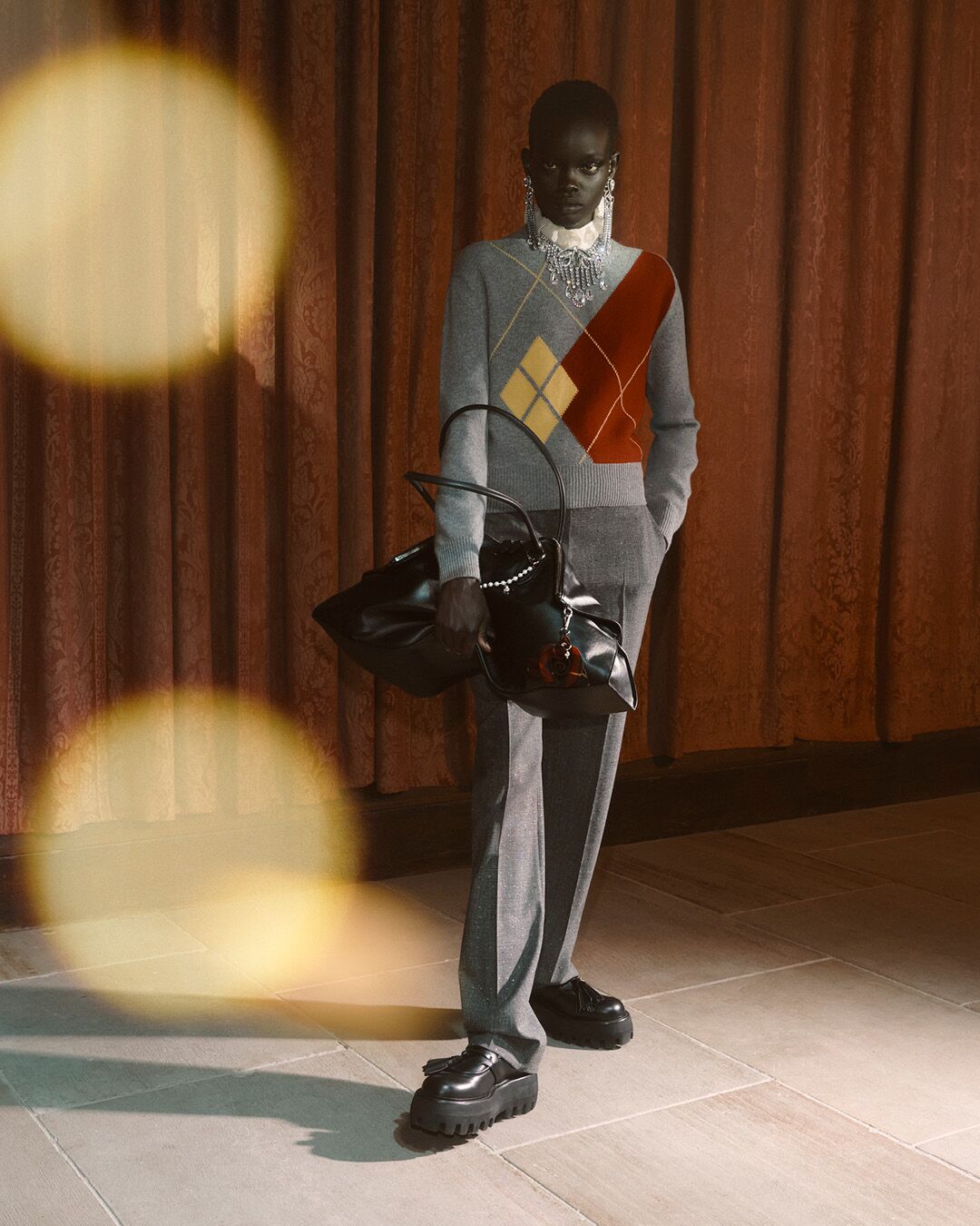 Model on set for McQueen Pre SS26 Campaign