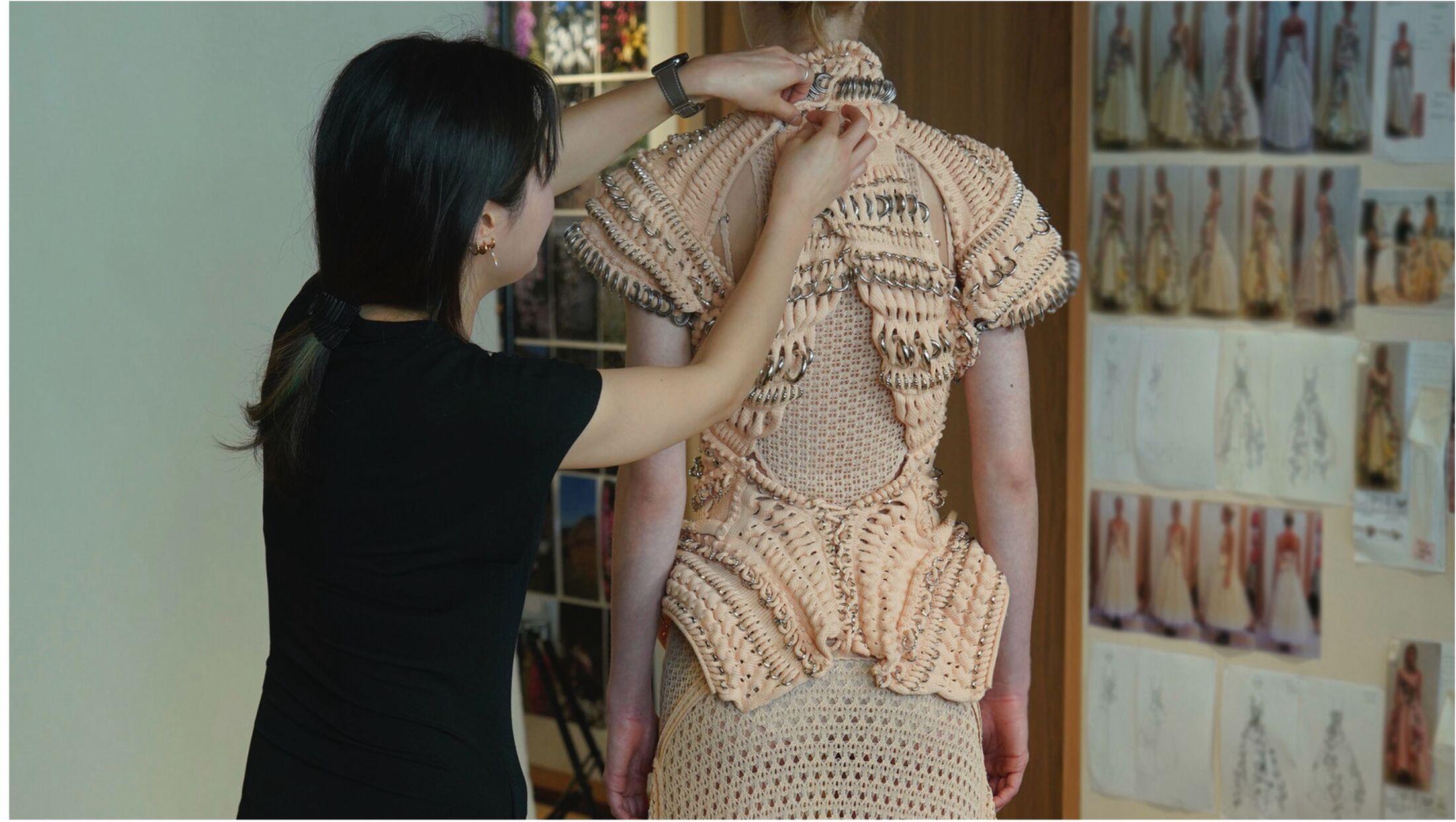 Student presenting work to McQueen team 