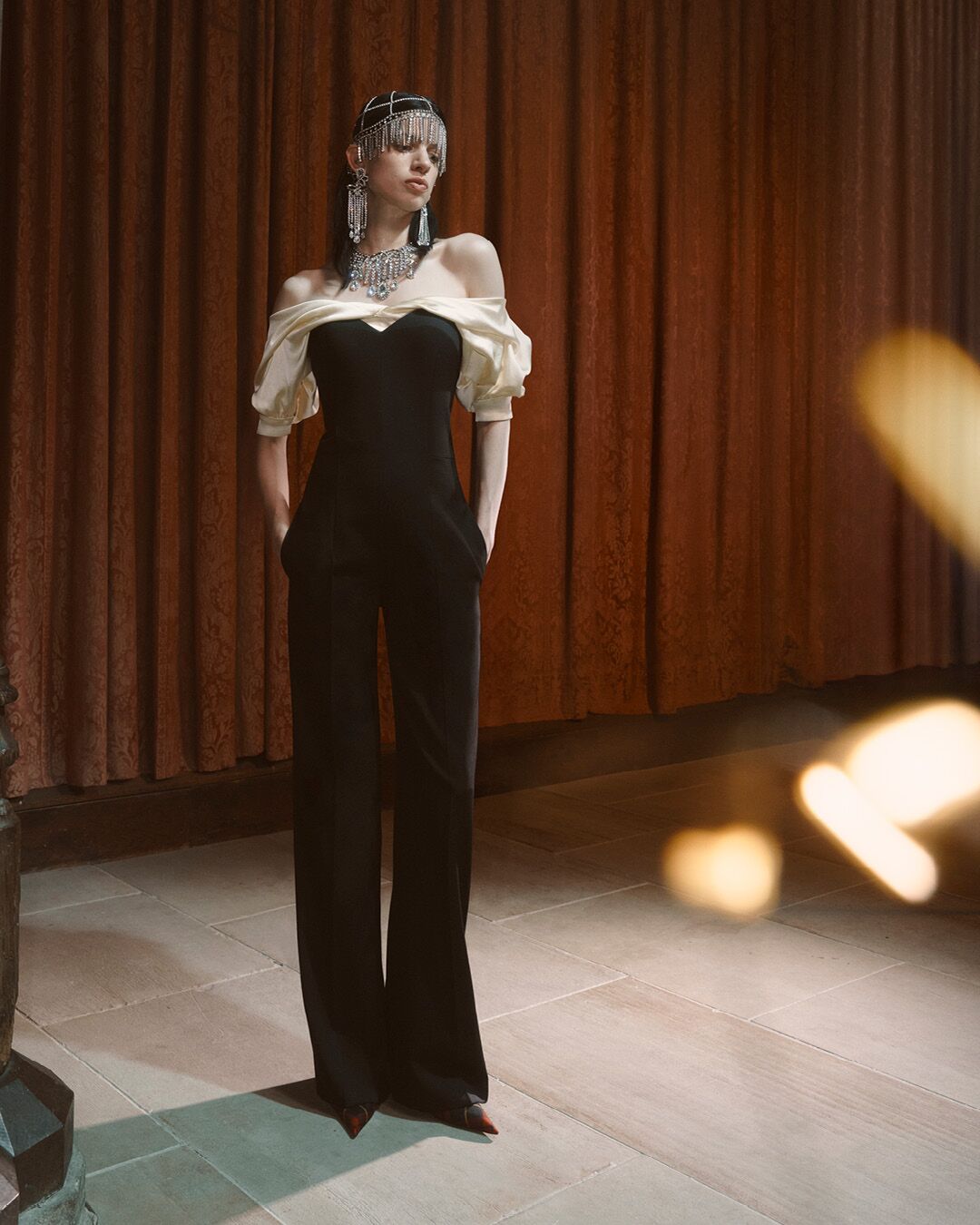 Model on set for McQueen Pre SS26 Campaign