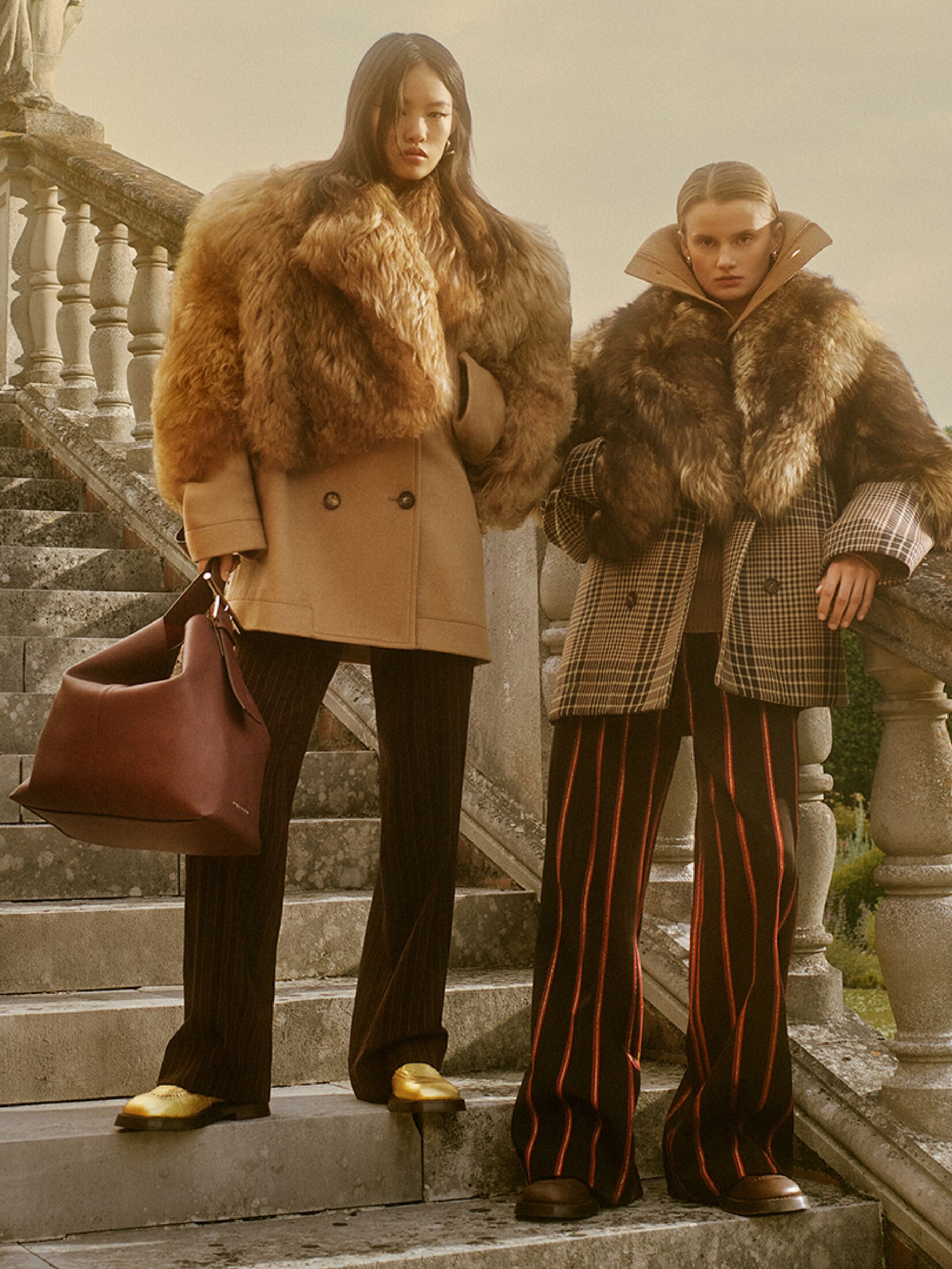 Two women in shearling and wool coats