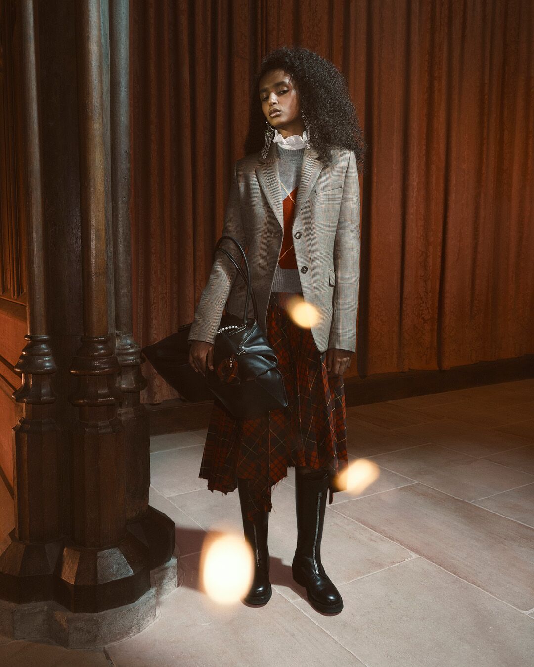 Model on set for McQueen Pre SS26 Campaign