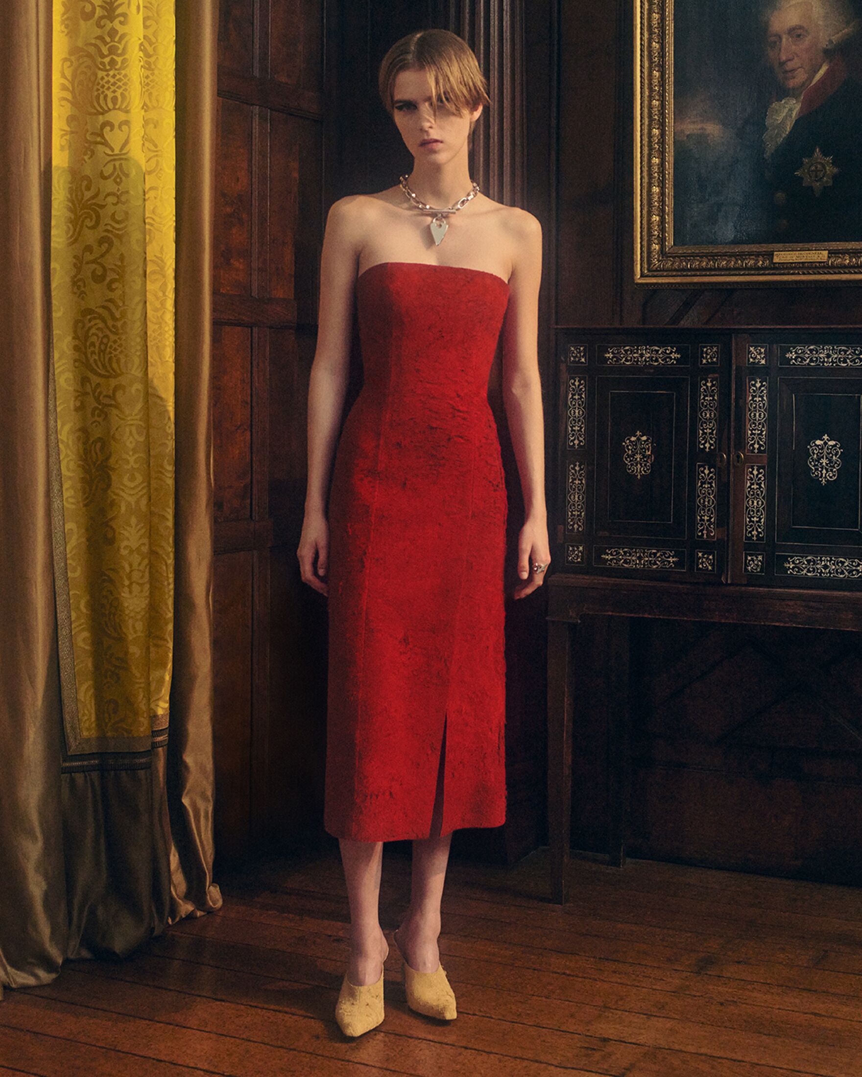 Model in aa red suede dress