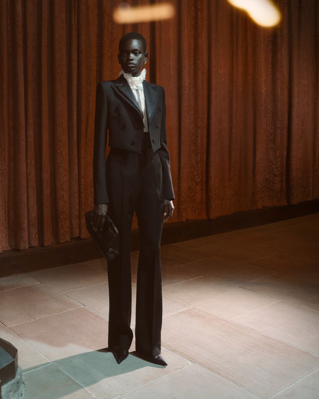 Model on set for McQueen Pre SS26 Campaign