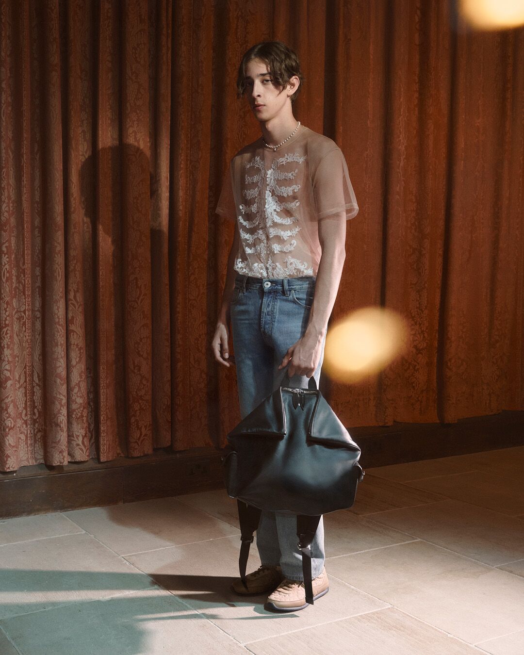 Model on set for McQueen Pre SS26 Campaign