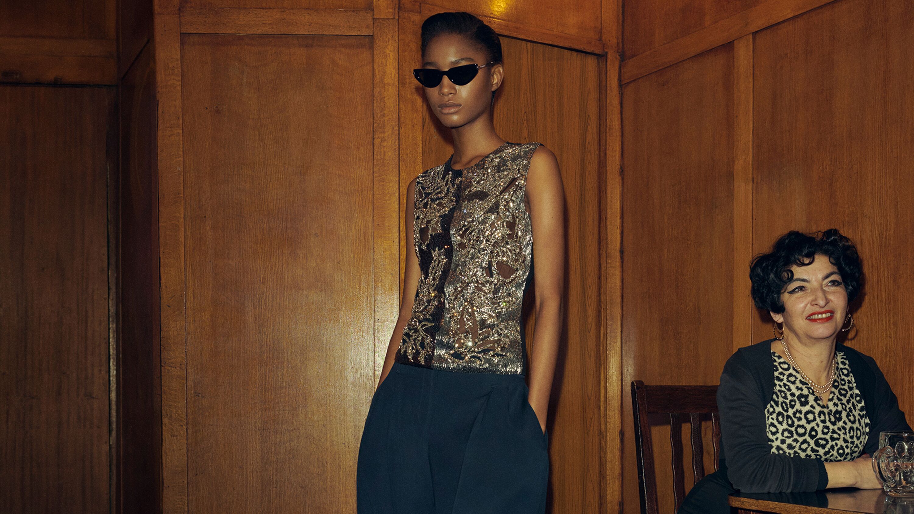 Women in a embellished black McQueen evening top