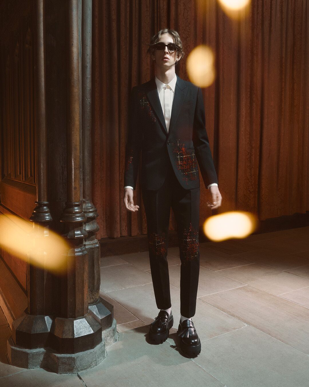 Model on set for McQueen Pre SS26 Campaign