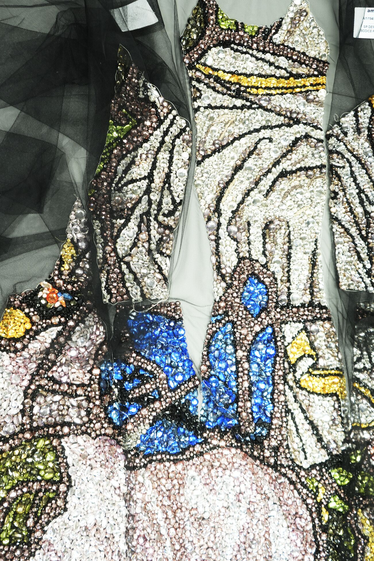 Embroidered panels aligned and prepared for sewing