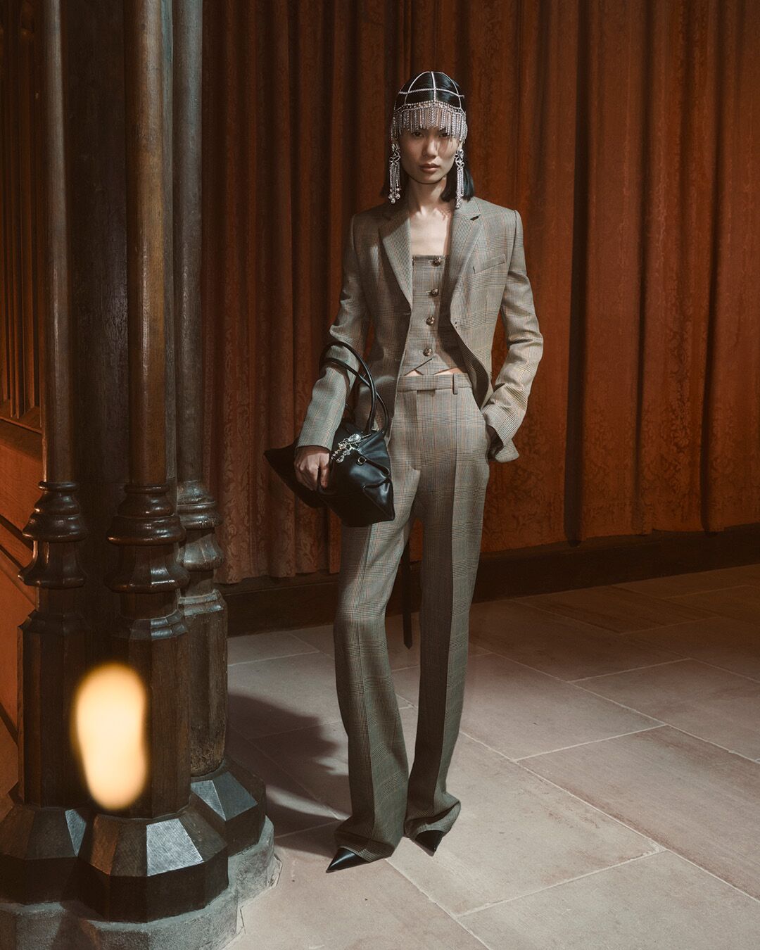 Model on set for McQueen Pre SS26 Campaign