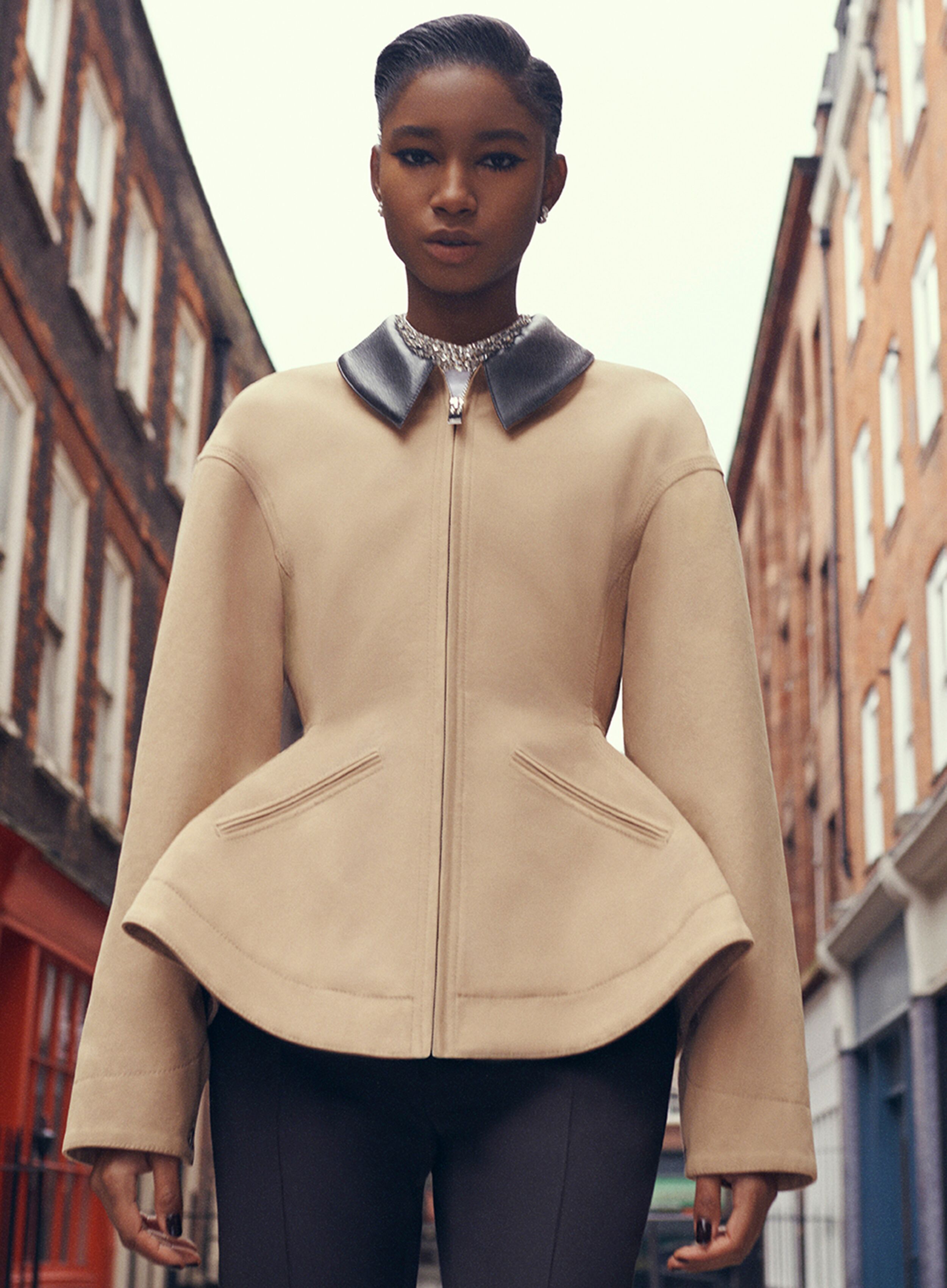 Model wearing structured peplum McQueen jacket