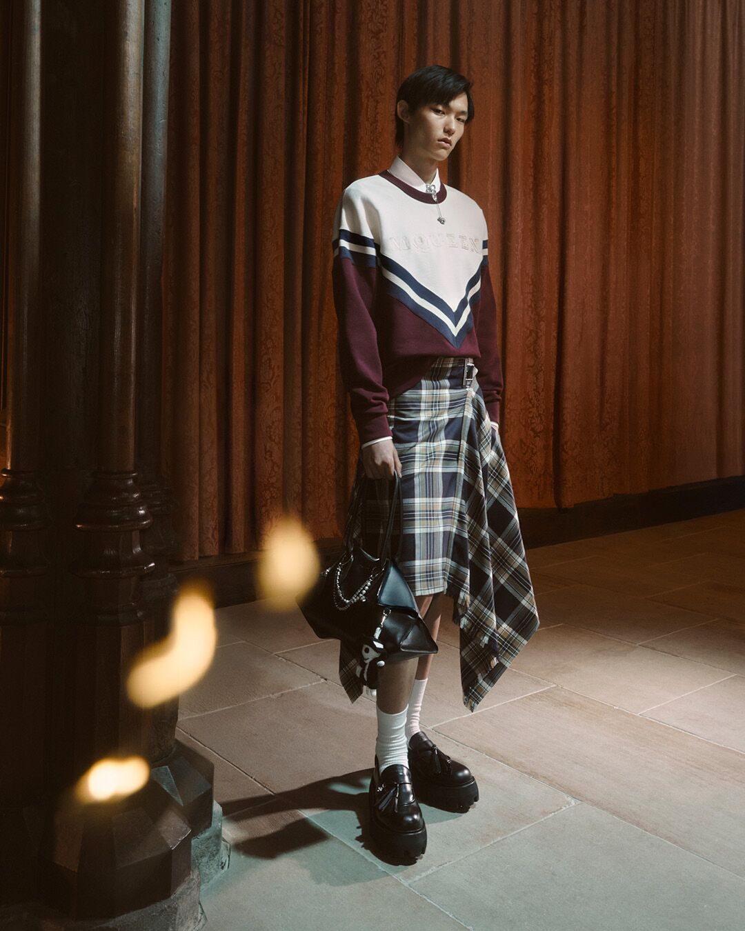 Model on set for McQueen Pre SS26 Campaign