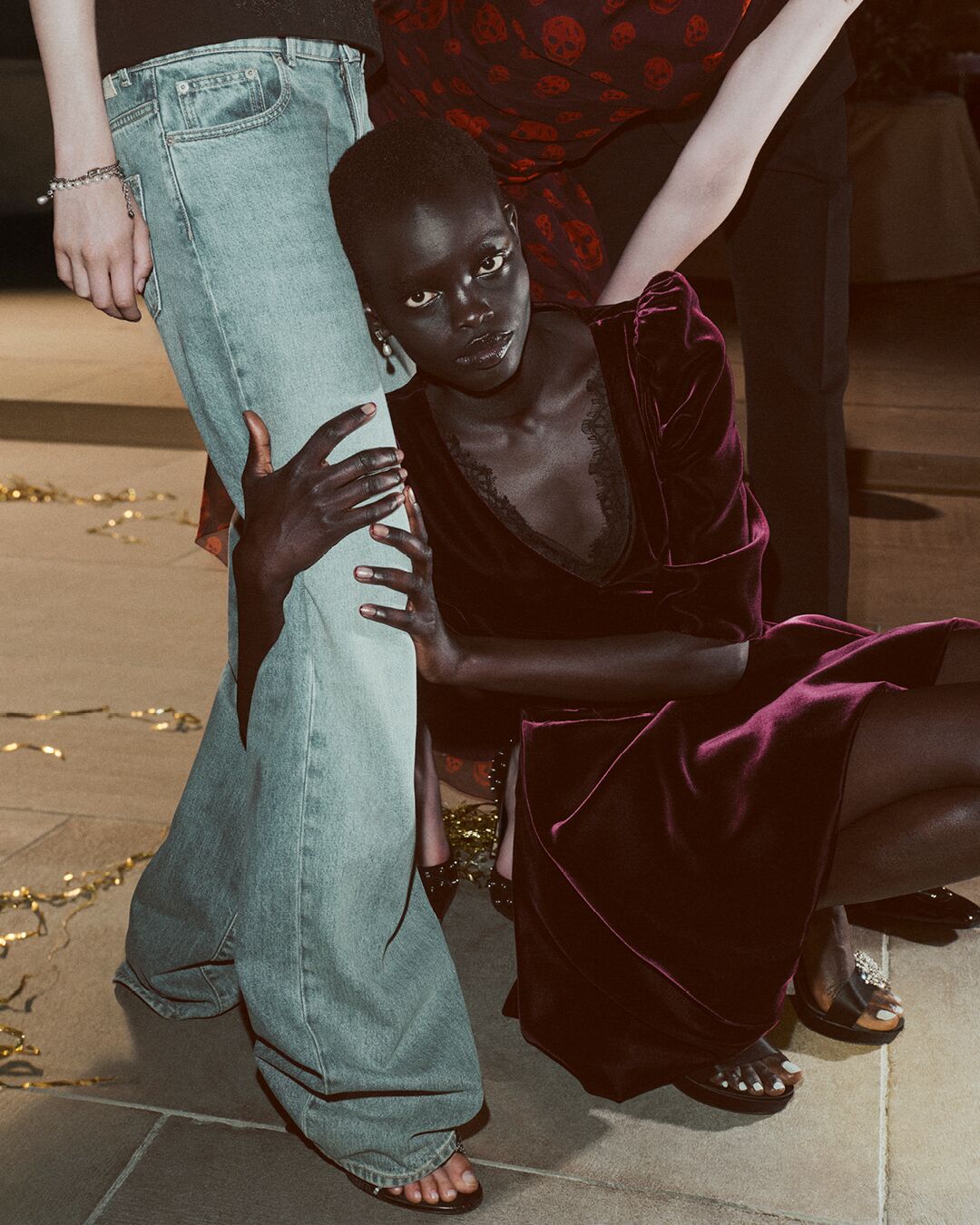 Model on set for McQueen Holiday 2025