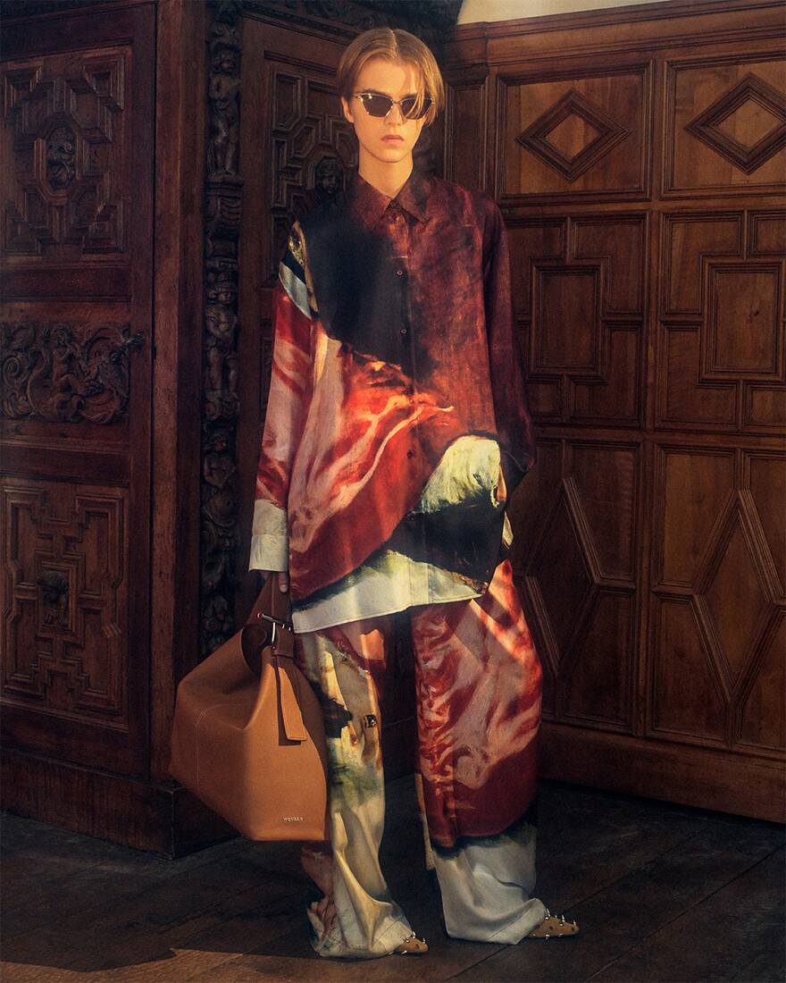 Libby wearing Alexander McQueen Spring Summer 2025 Pre-collection with T-Bar Sling Shoulder Bag in soft tan at Hatfield House