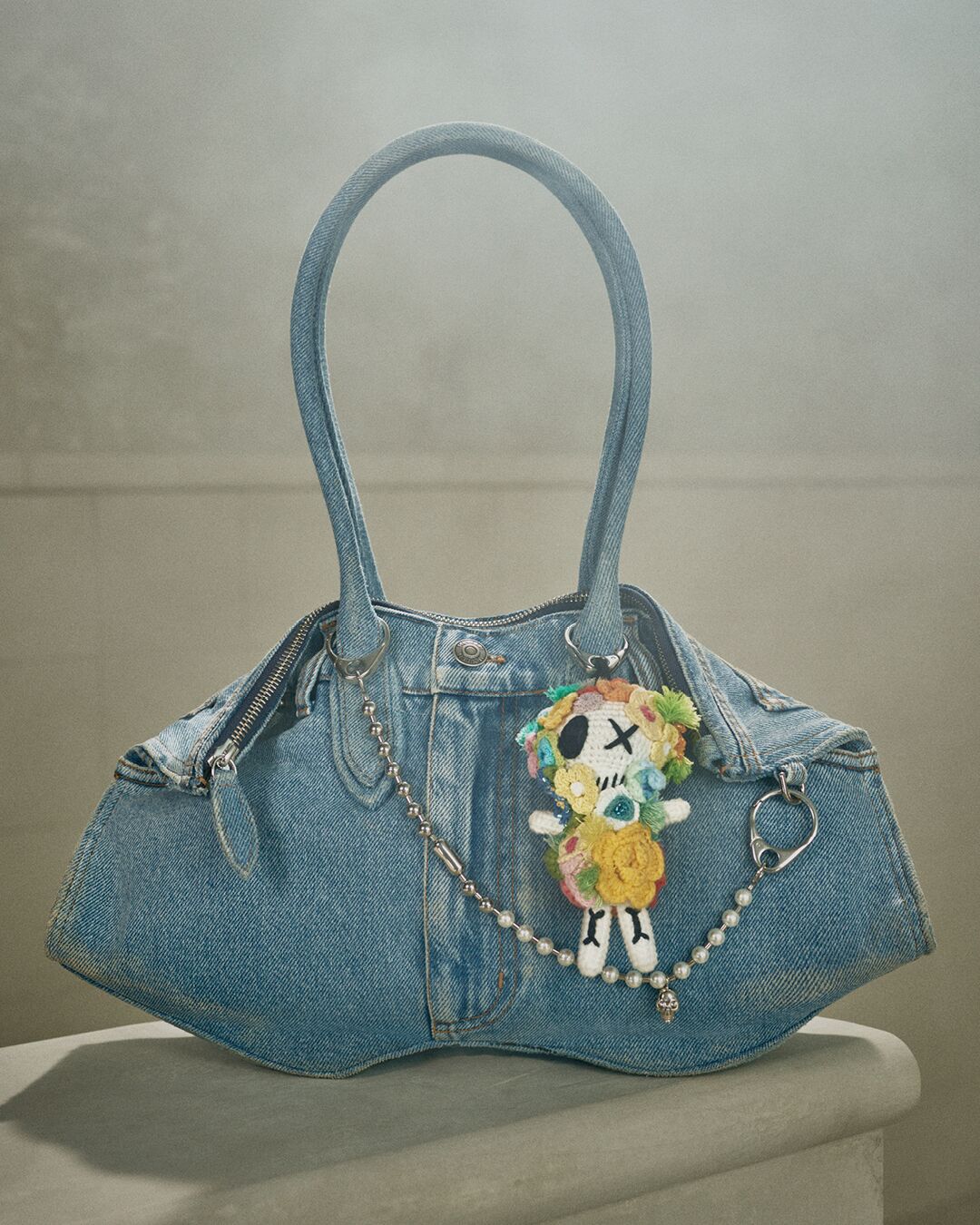 Manta bag in denim with McQueen charms