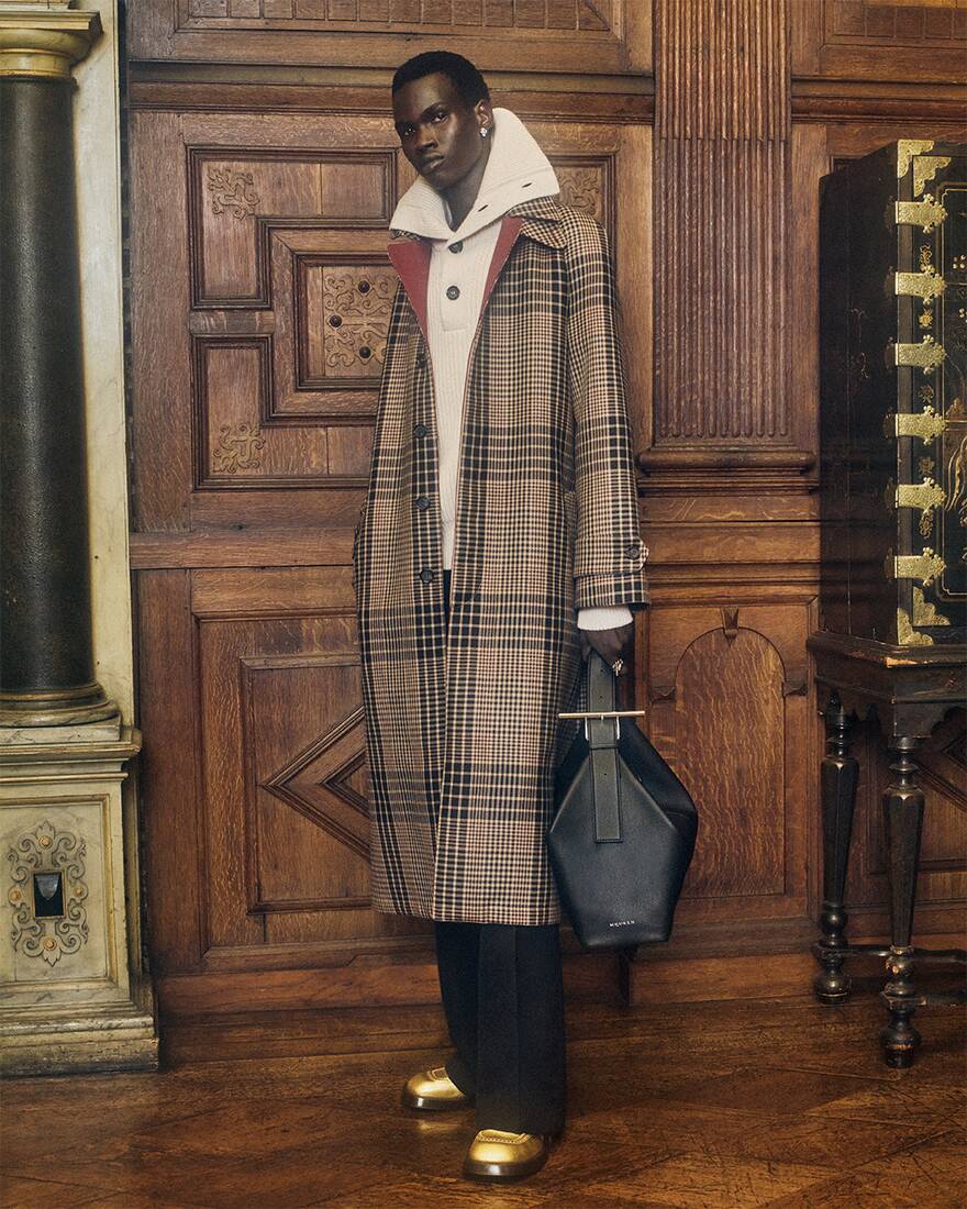Miral Akech wearing Alexander McQueen Spring Summer 2025 Pre-collection with T-Bar Sling Shoulder bag in black at Hatfield House