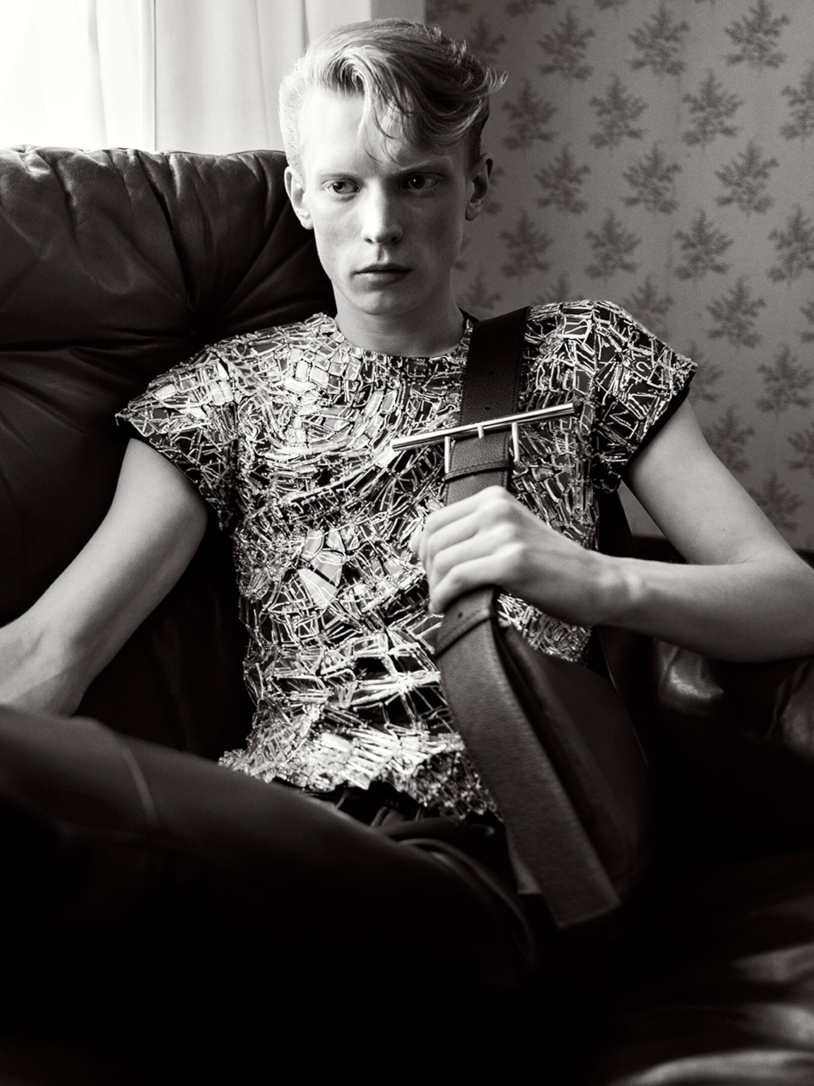 Man wearing a smashed screen t-shirt and shoulder sling bag