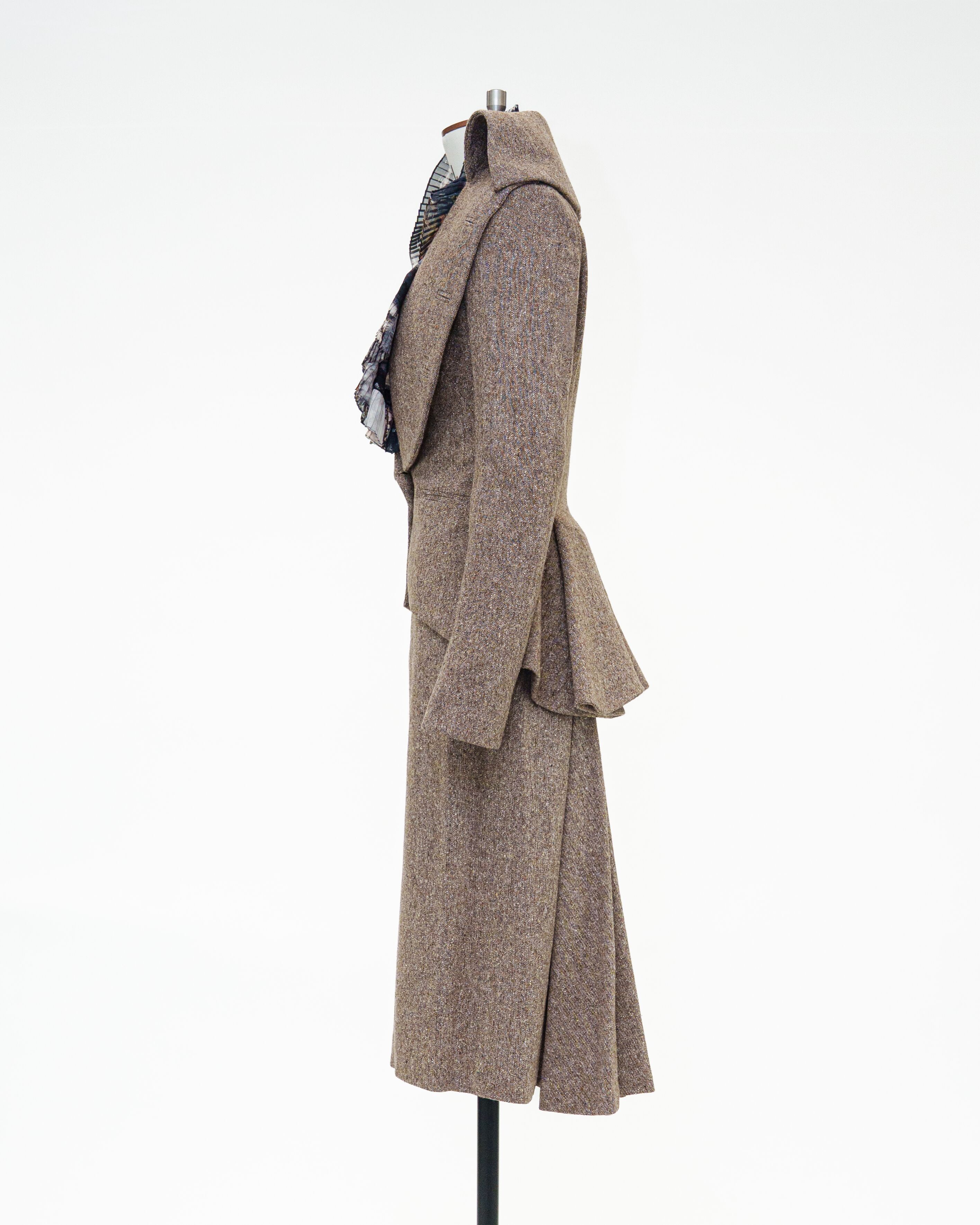 Side view of tailored jacket and skirt on mannequin
