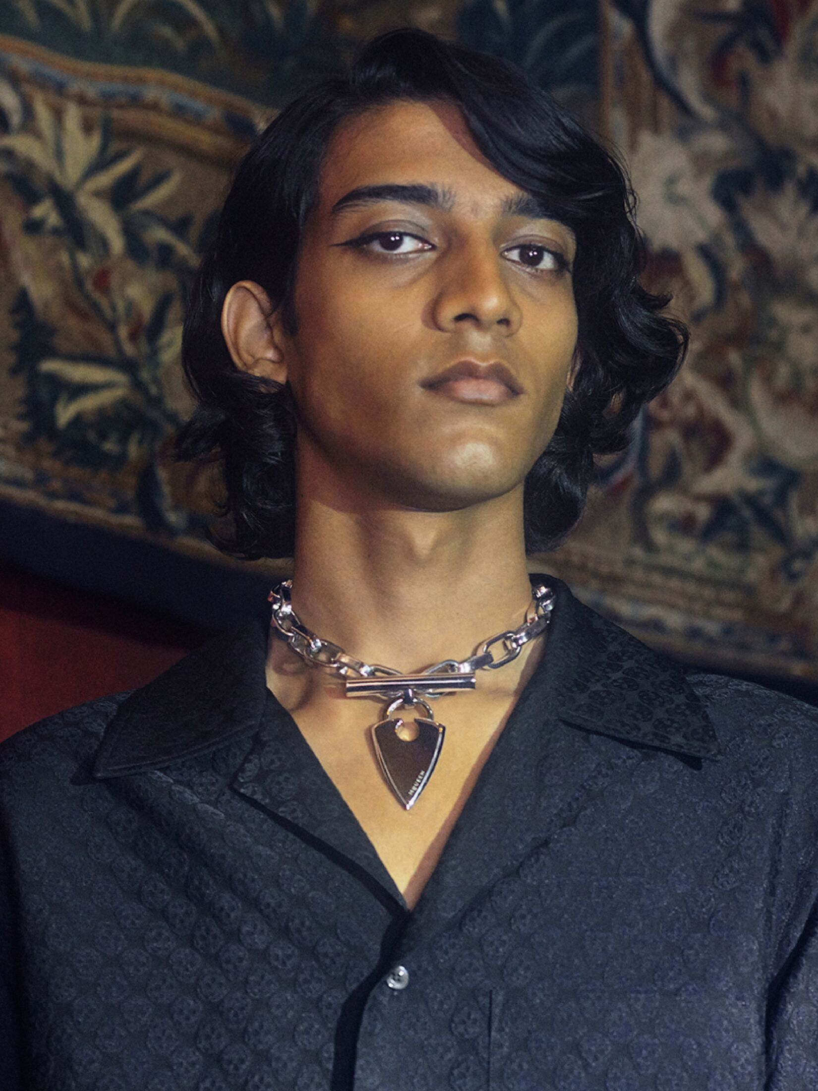 Model wearing silver necklace