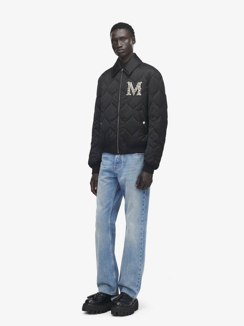 Steppjacke mit Kristalllogo