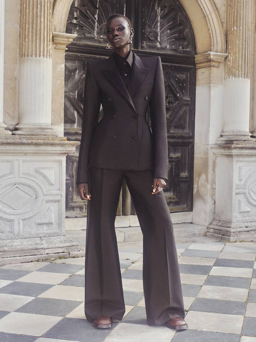 Women in black tailored suit