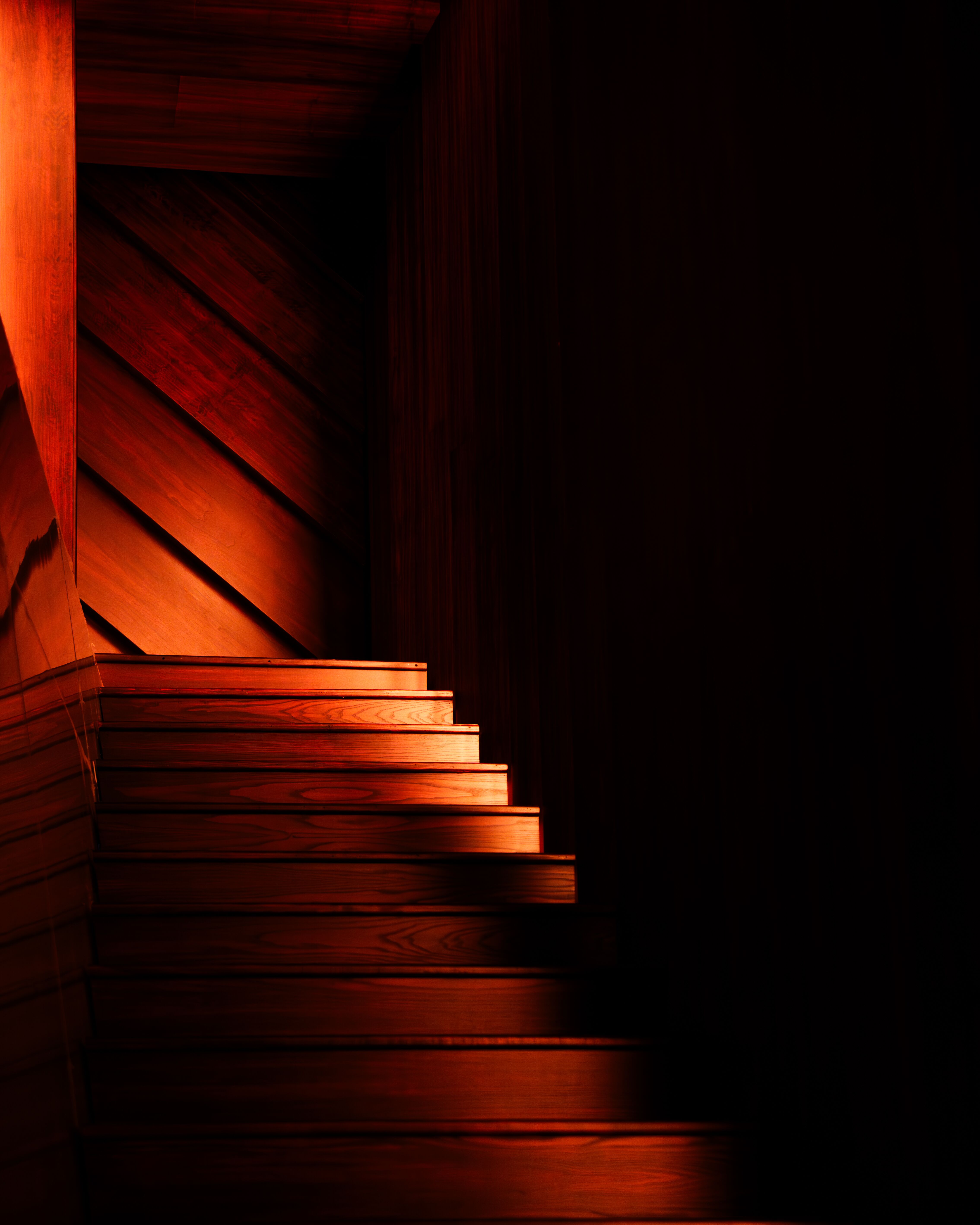 Staircase lit with warm lighting at McQueen Autumn Winter 2025 Show