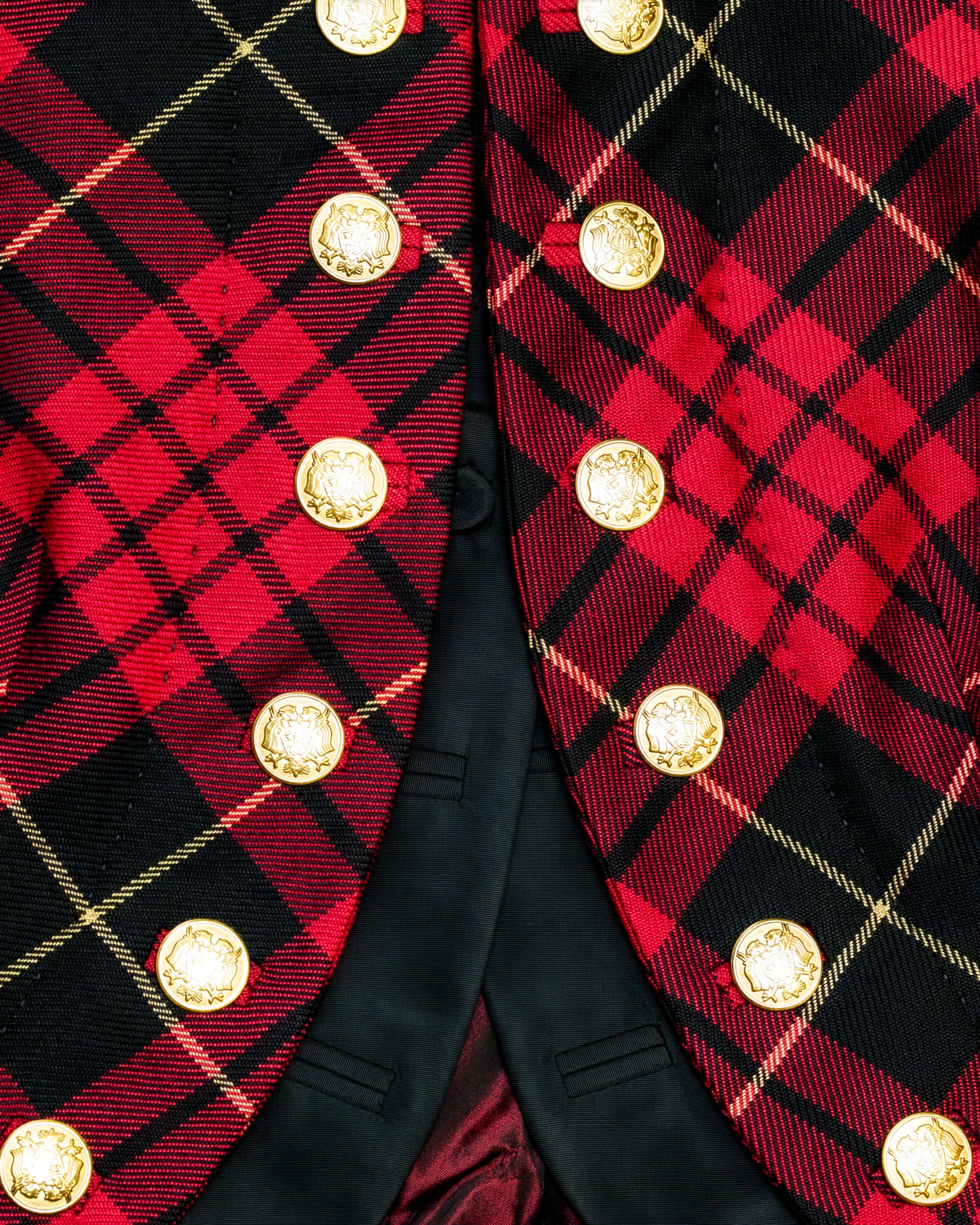 Close up of tartan jacket with gold buttons
