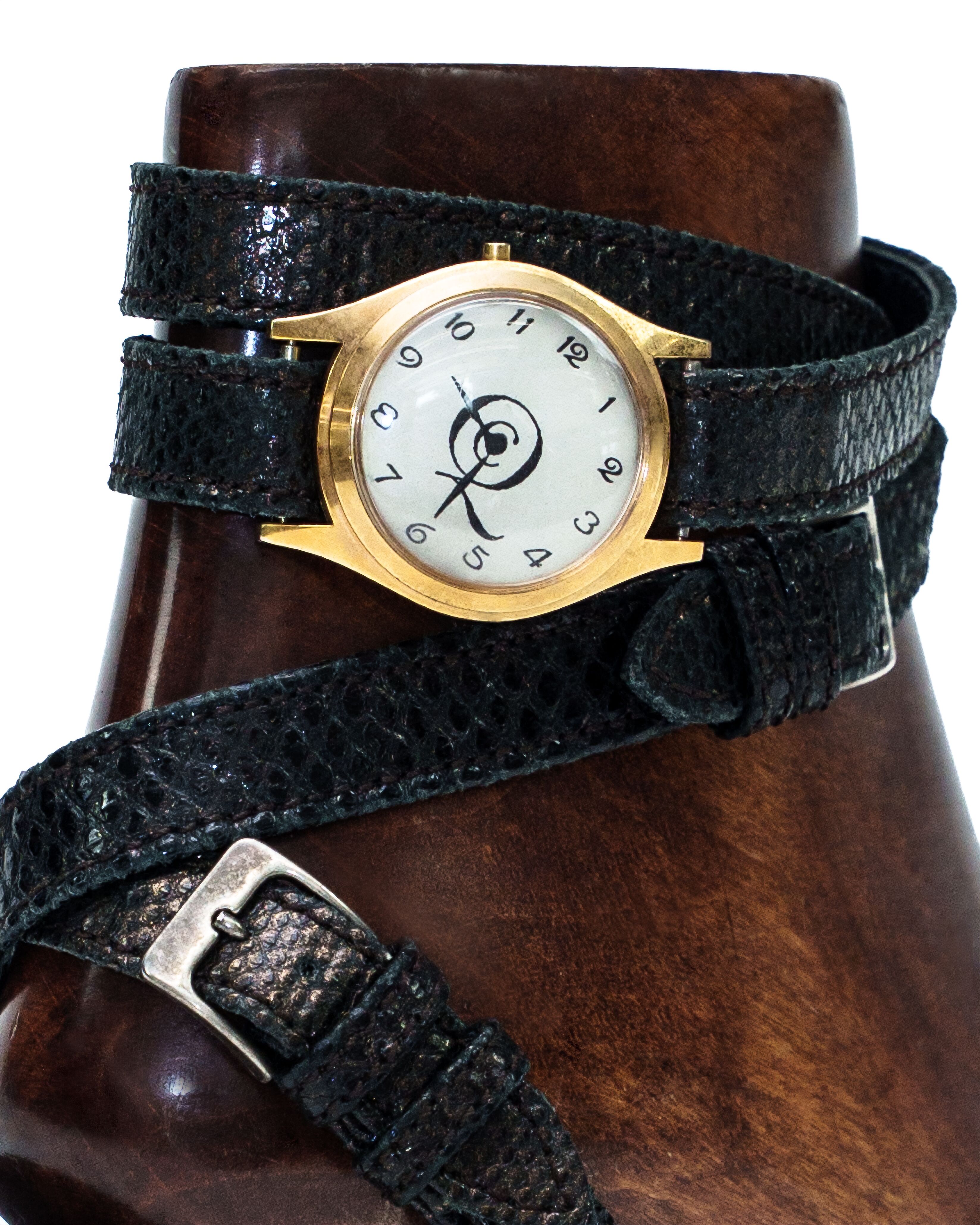 Sandals in embossed leather with watch face detailing.