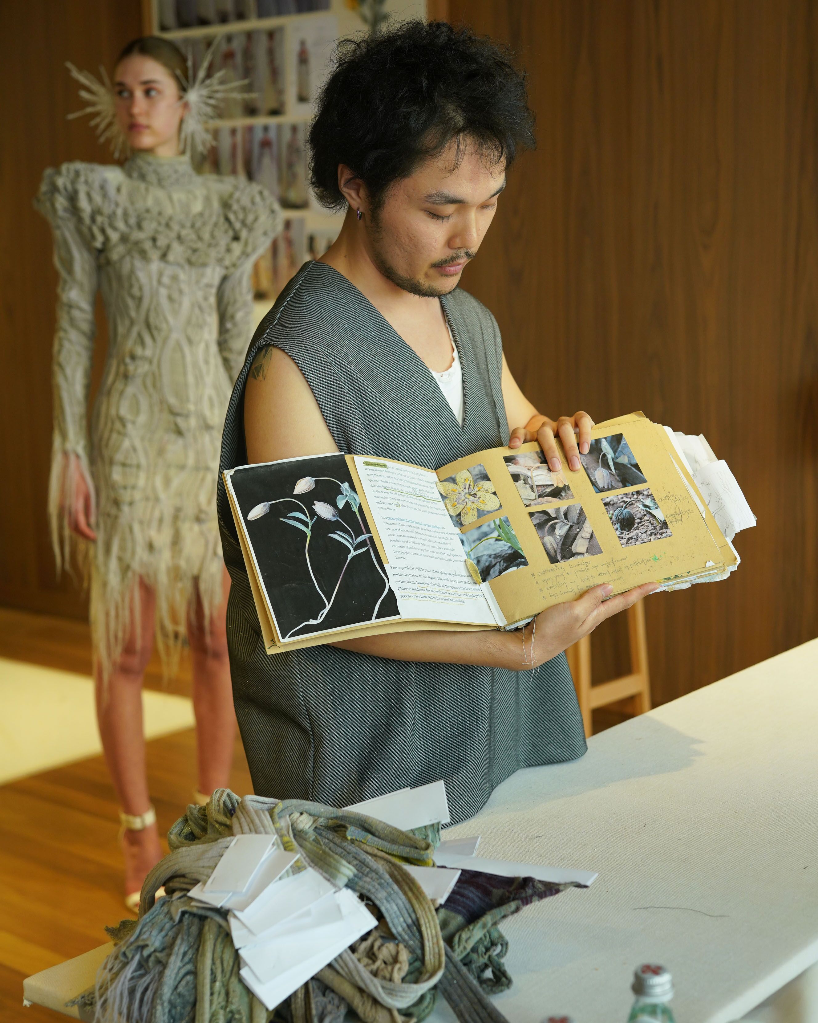 Student presenting work to McQueen Design team