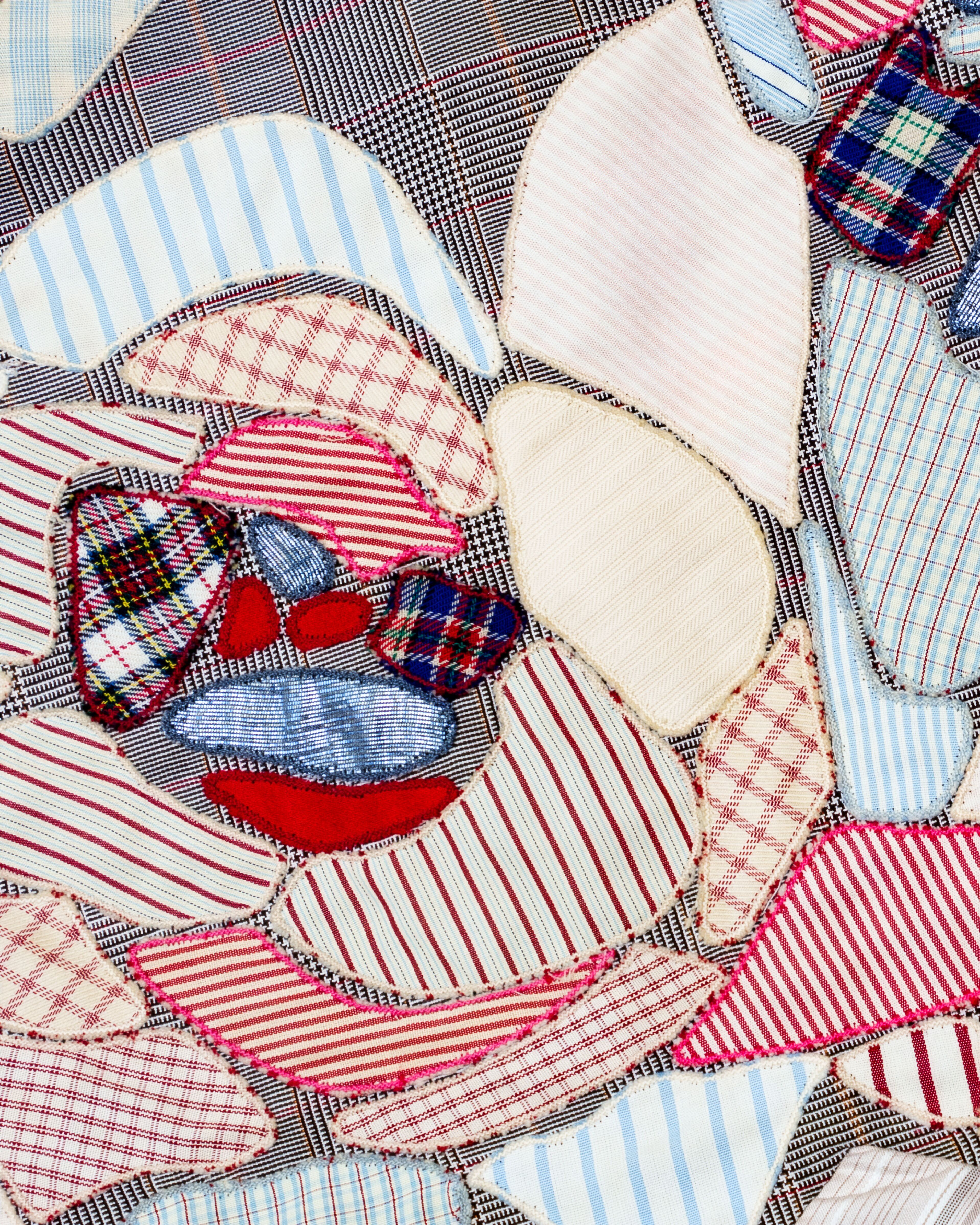 McQueen Deliverance Spring Summer 2004 Look 95: Tailored skirt in Prince of Wales wool with multi-patterned floral appliqué and patchwork details.