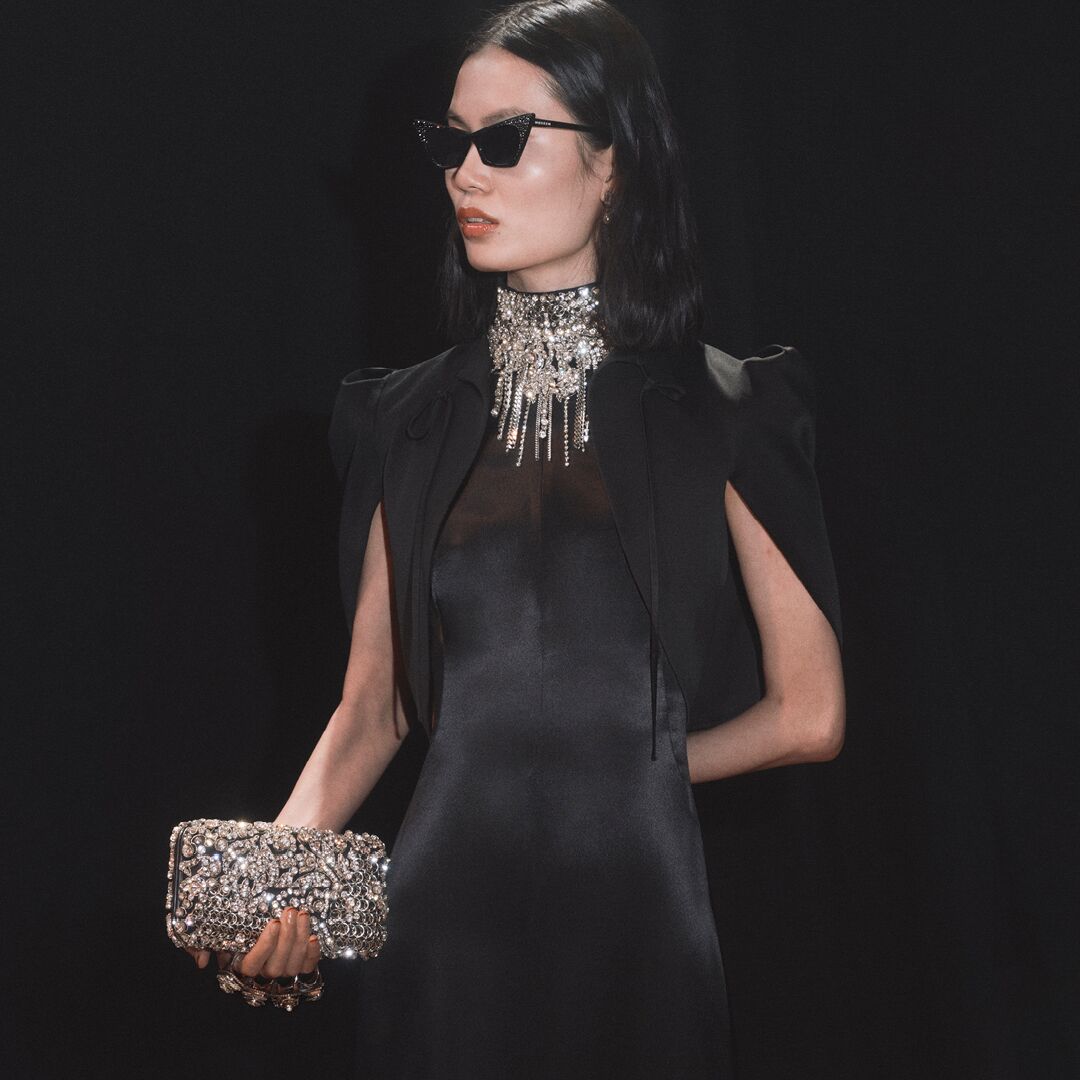 Alexander McQueen evening dress and McQueen knuckle clutch