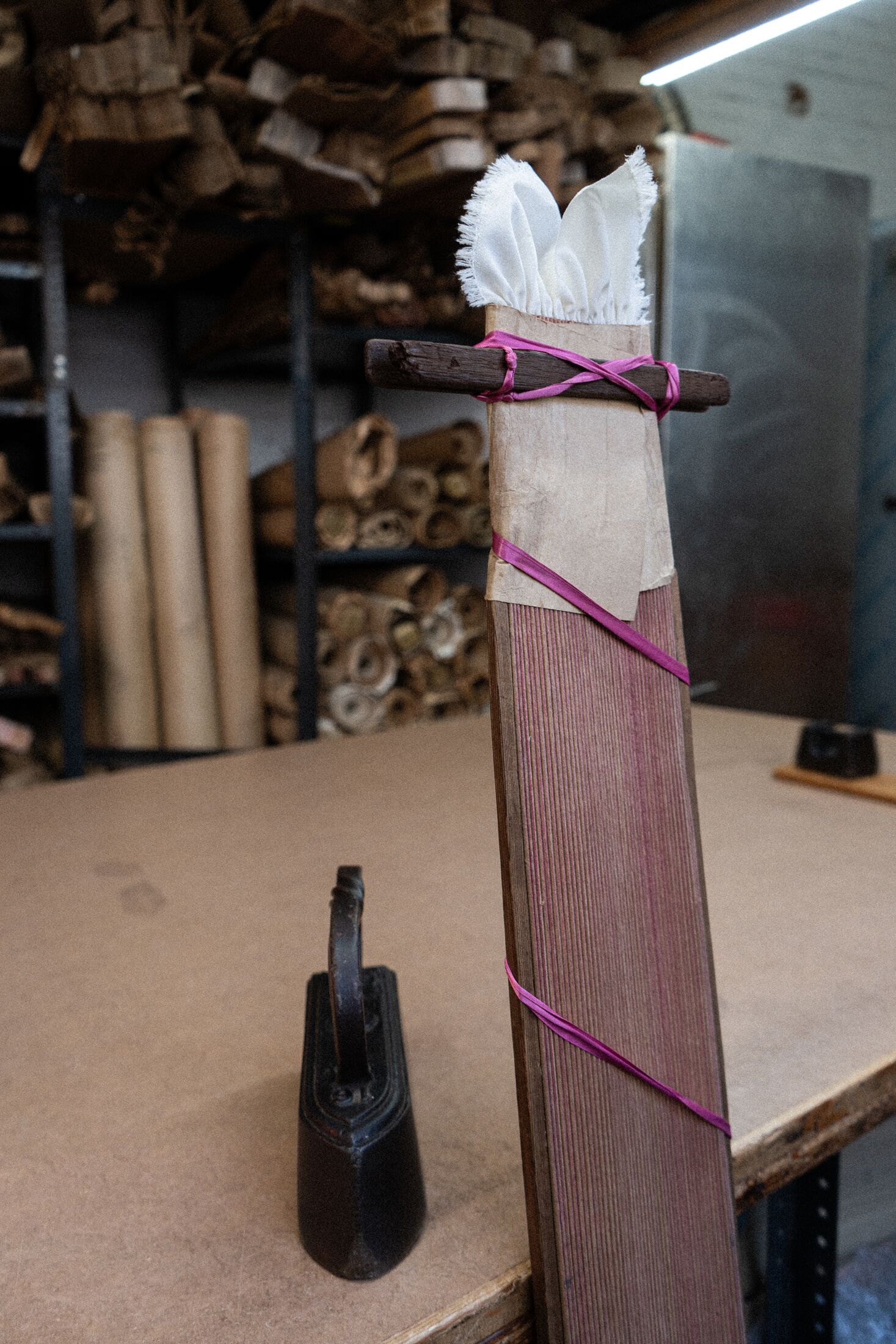 Fabric pleated and bound to be placed in steamer to set sunray pleats