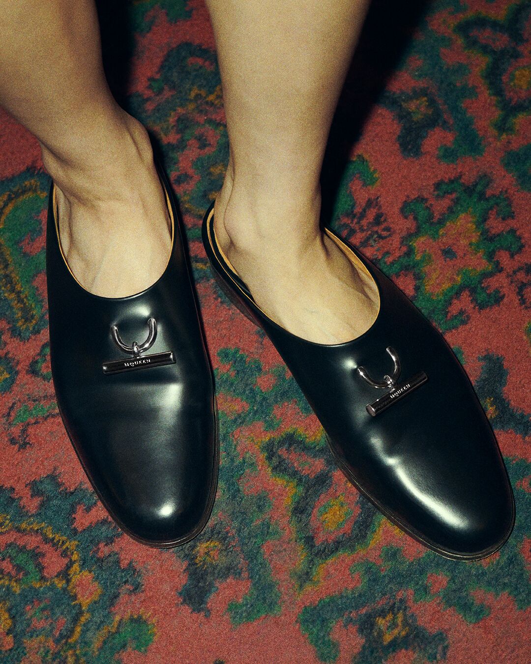McQueen T-Bar Slip on Mule in black at Coach and Horses shoot 