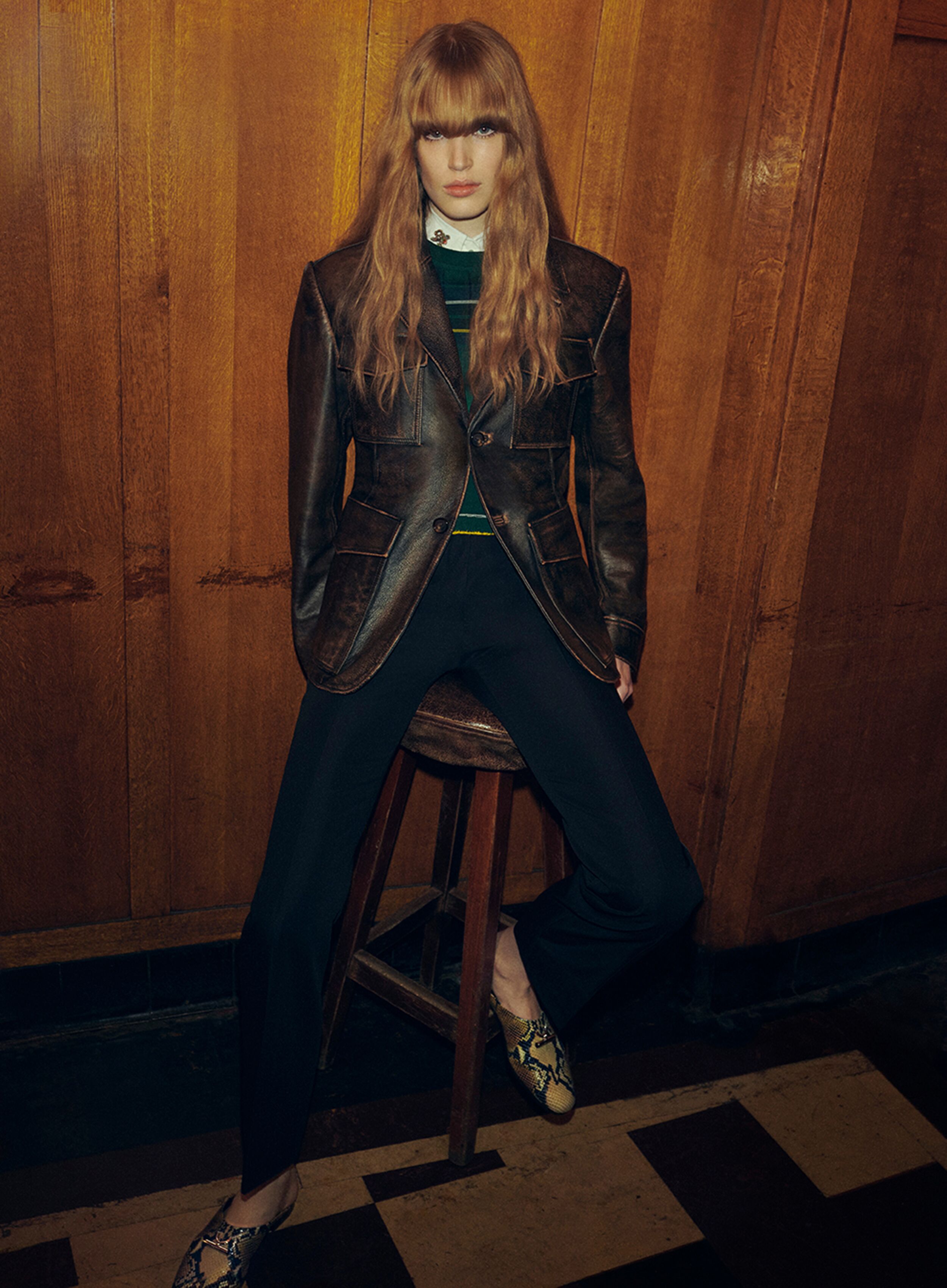 Women in Alexander McQueen leather jacket and shirt