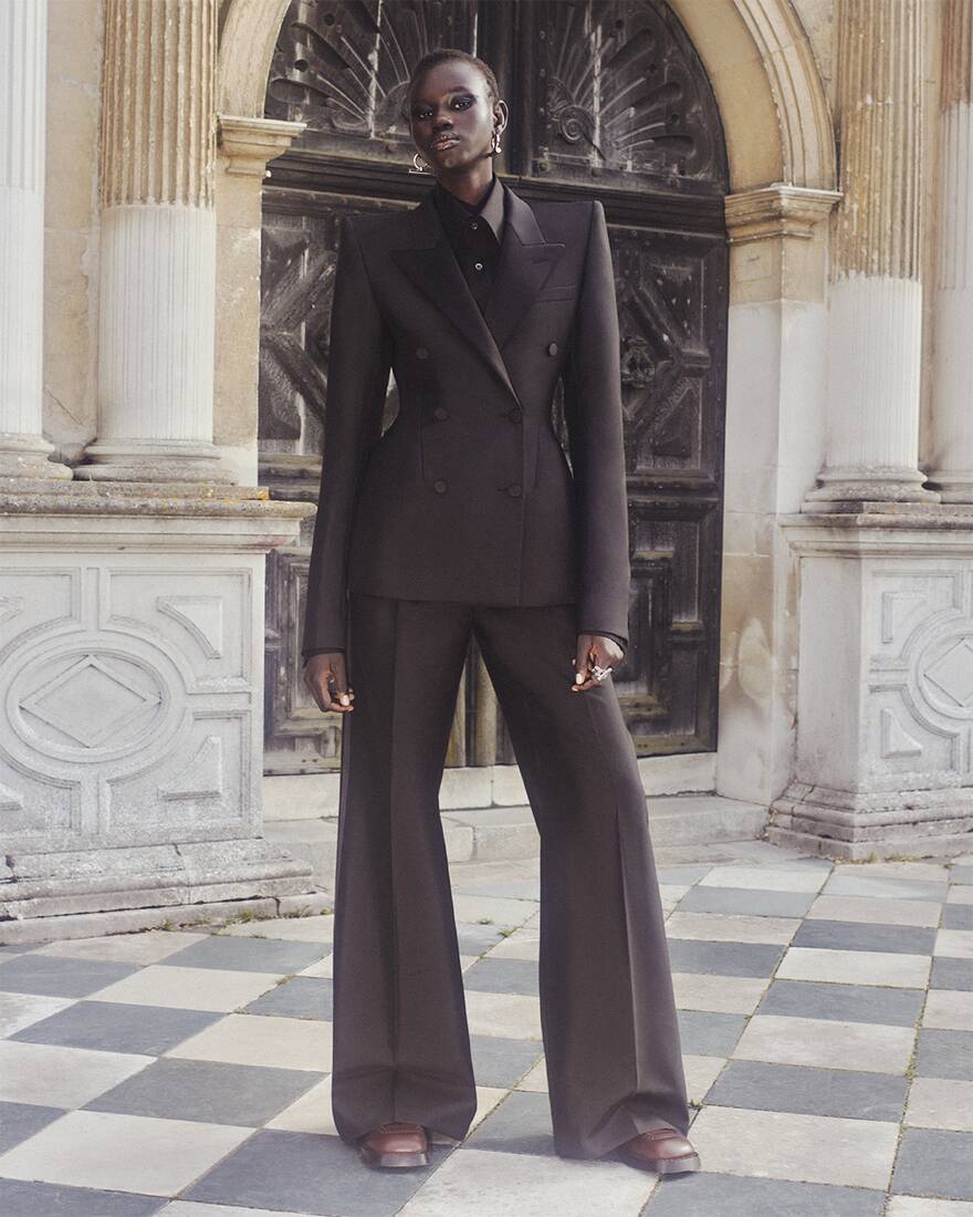 Rejoice Chuol wearing Alexander McQueen Spring Summer 2025 Pre-collection Stacked Shoulder Double-Breasted Jacket and wide leg trousers at Hatfield House
