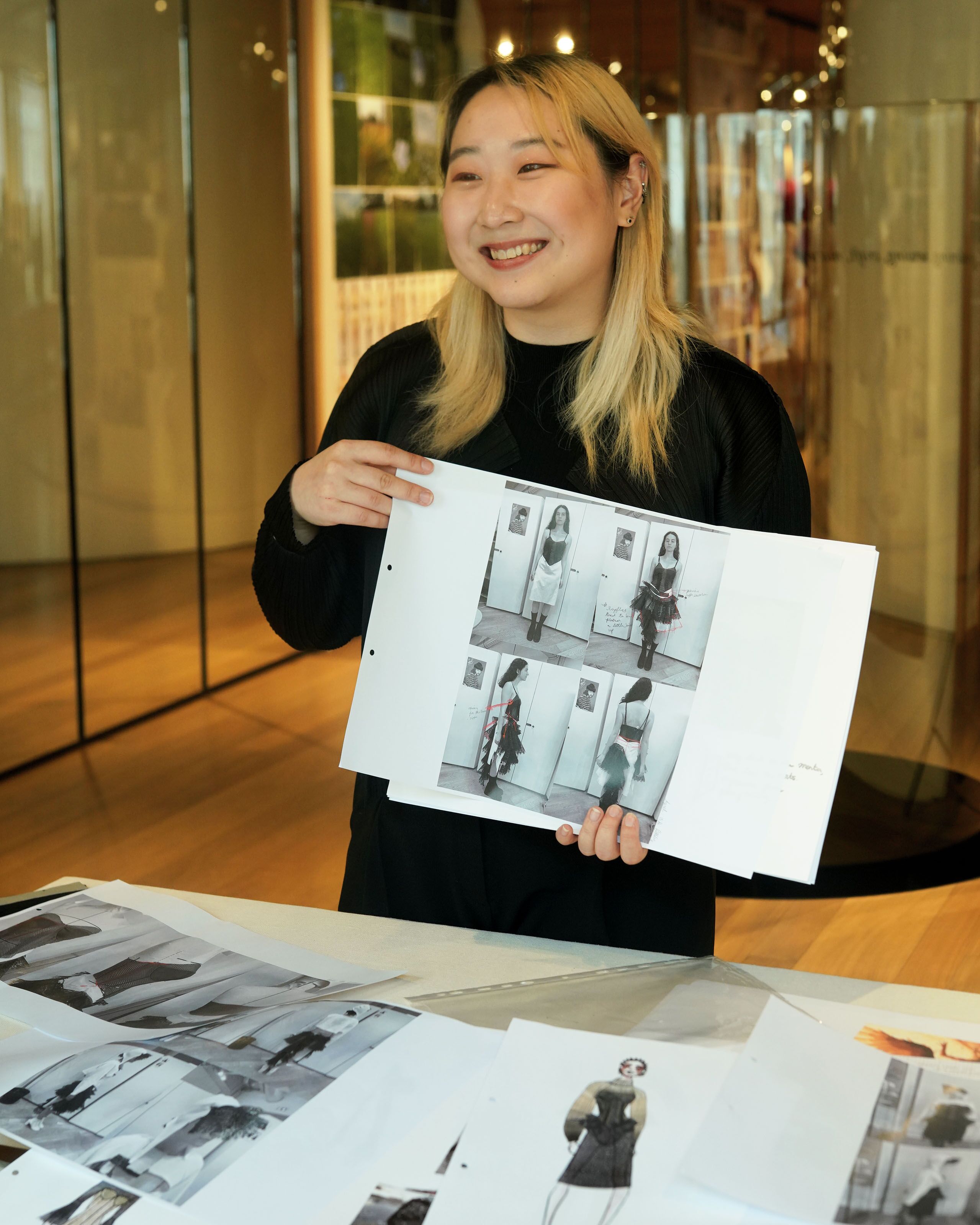 Student presenting work to McQueen team