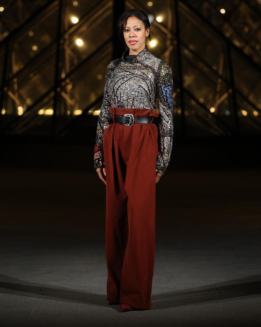 Deana Lawson wearing Light-refracting crystal embroidered top and red trousers