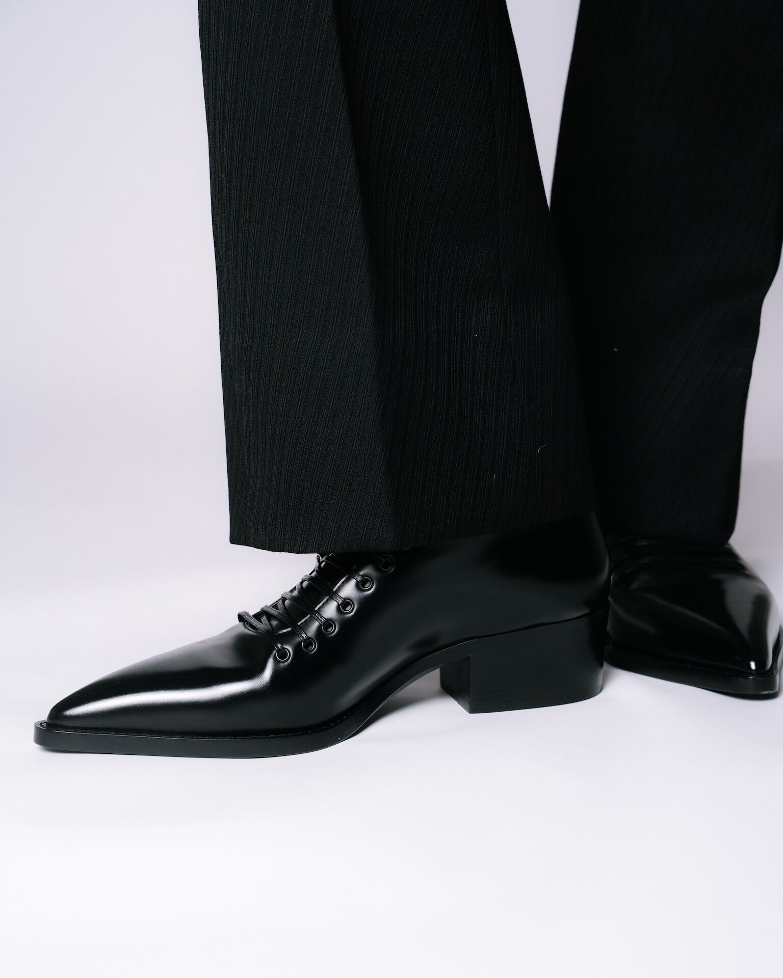 McQueen Heron Oxfords in black leather photographed at fitting