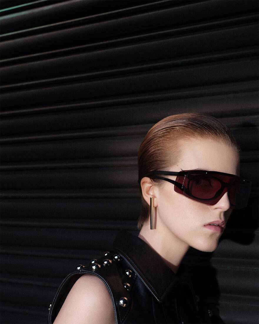 Model wearing McQueen sunglasses