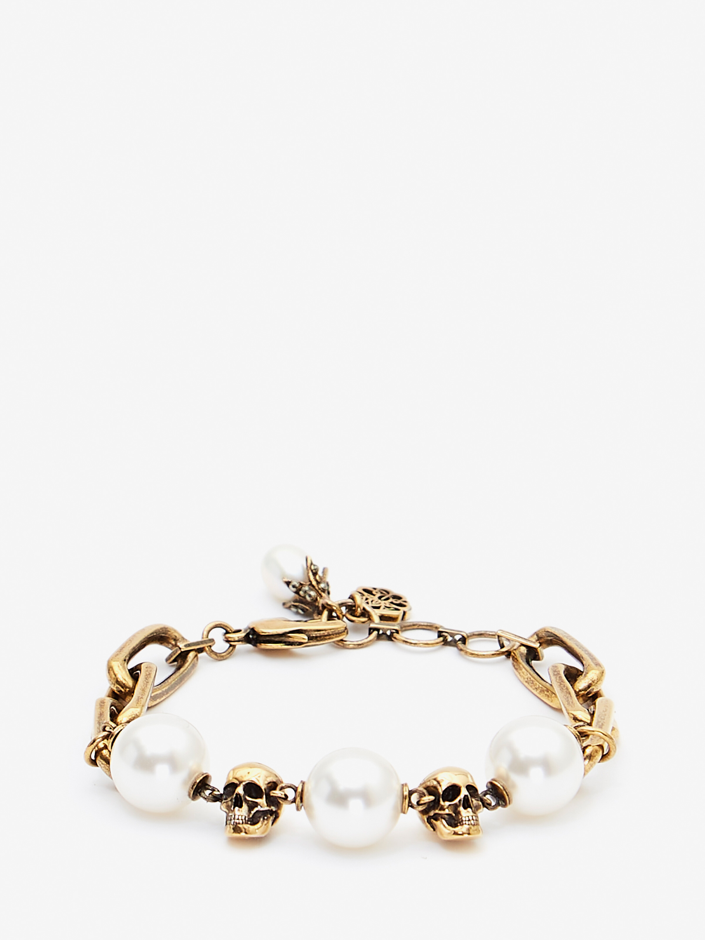 Shop Alexander Mcqueen Pearl-like Skull Chain Bracelet In Antique Gold