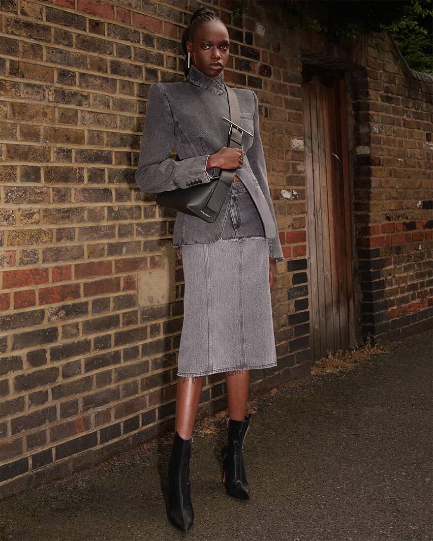 model in denim jacket and two-tone denim skirt