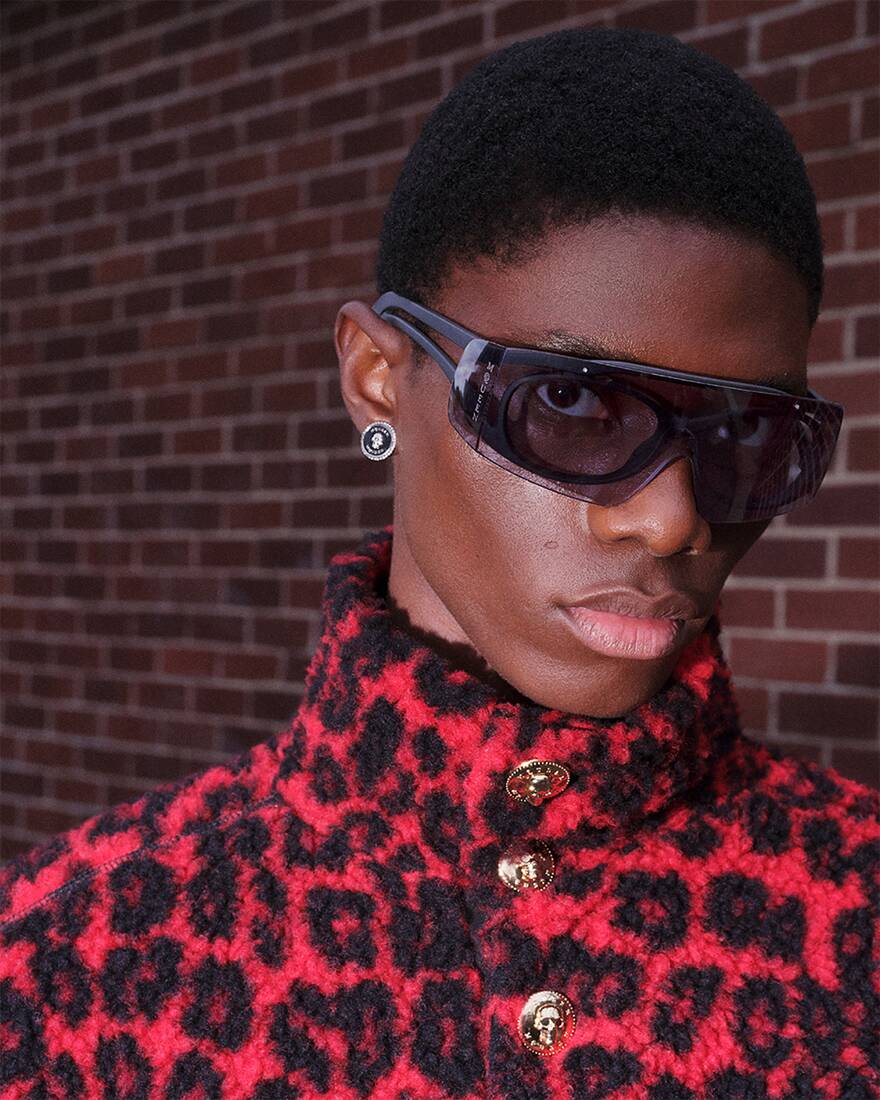 model wearing black sunglasses