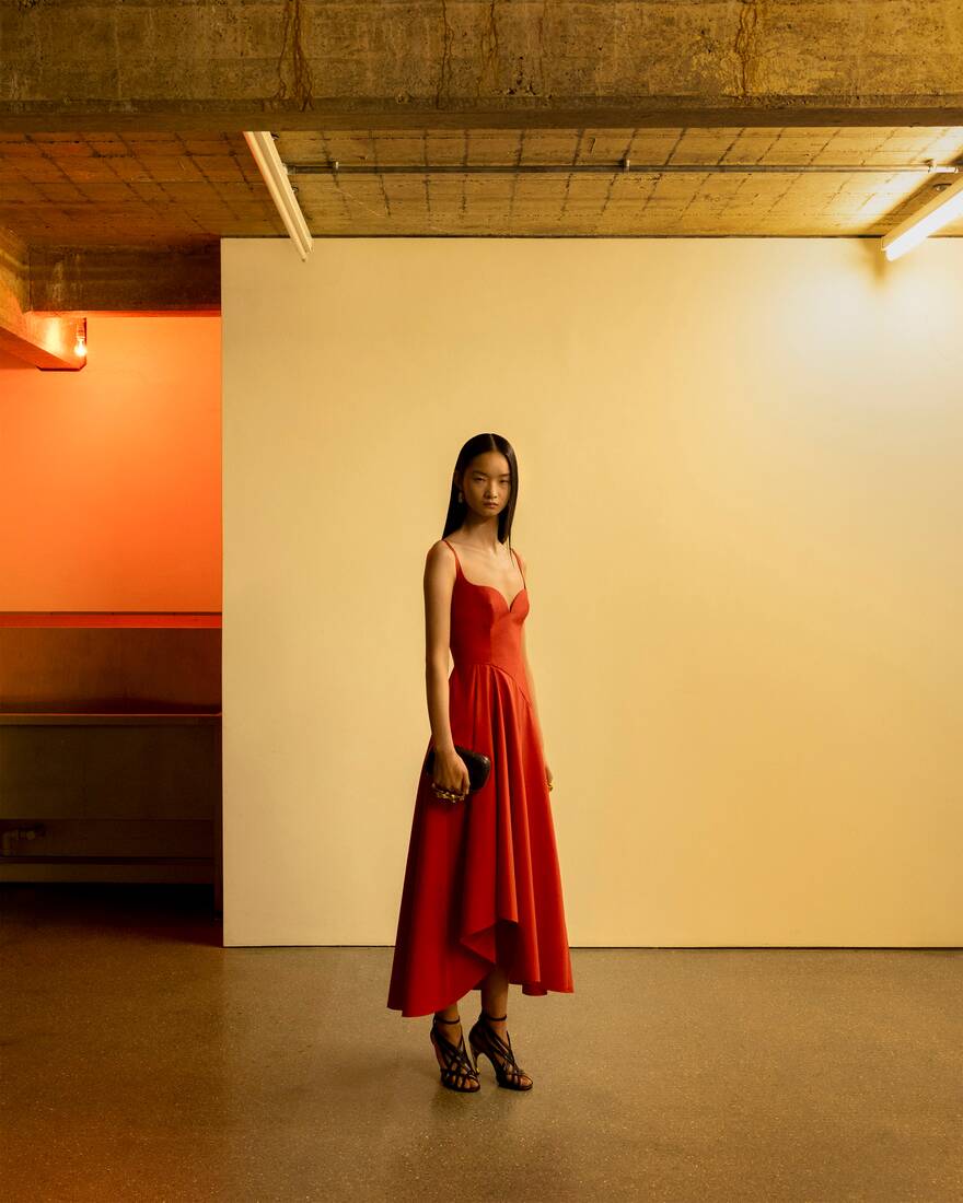 Model wearing red midi dress