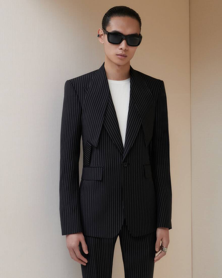 Model wearing black pinstripe suit