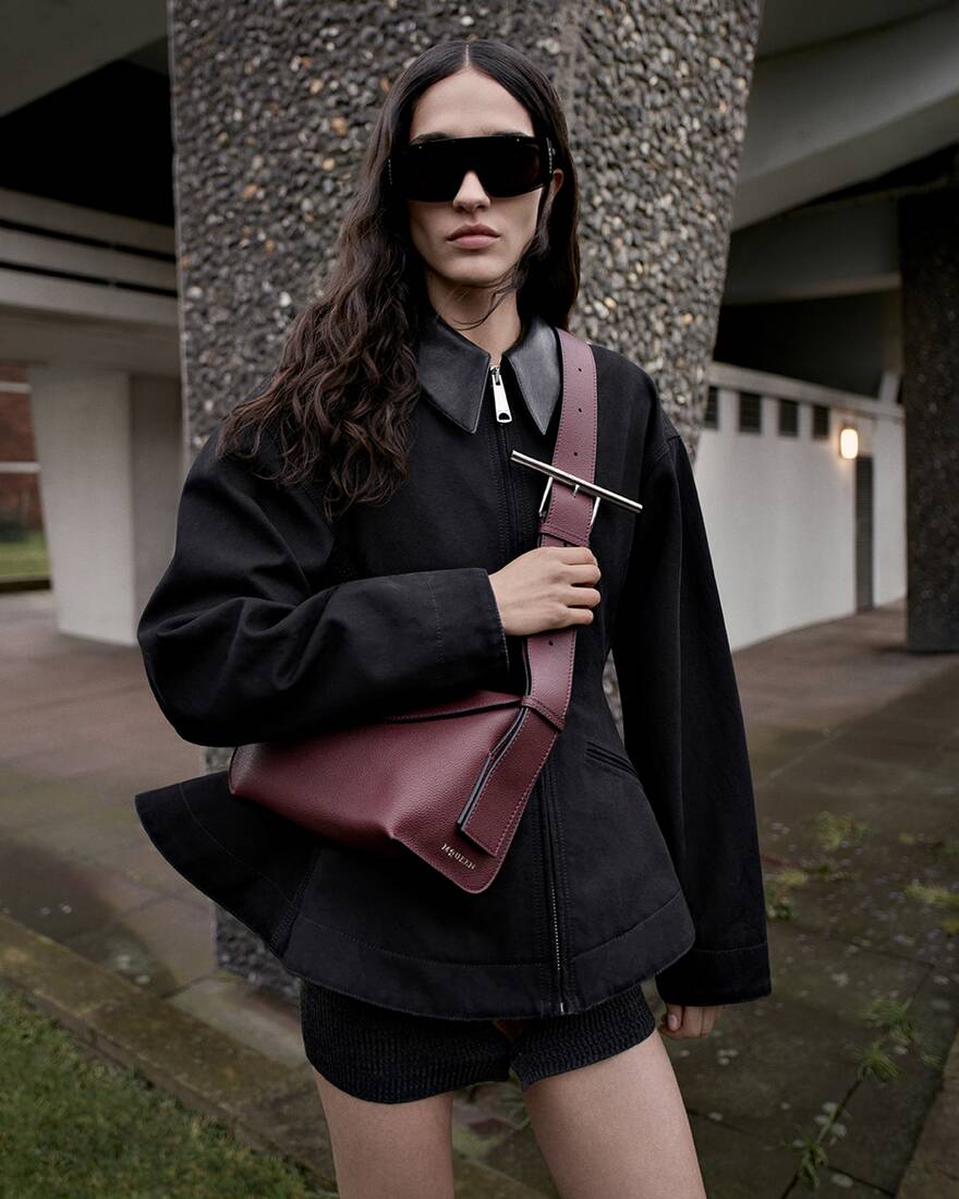 Model wearing a burgundy crossbody Sling bag